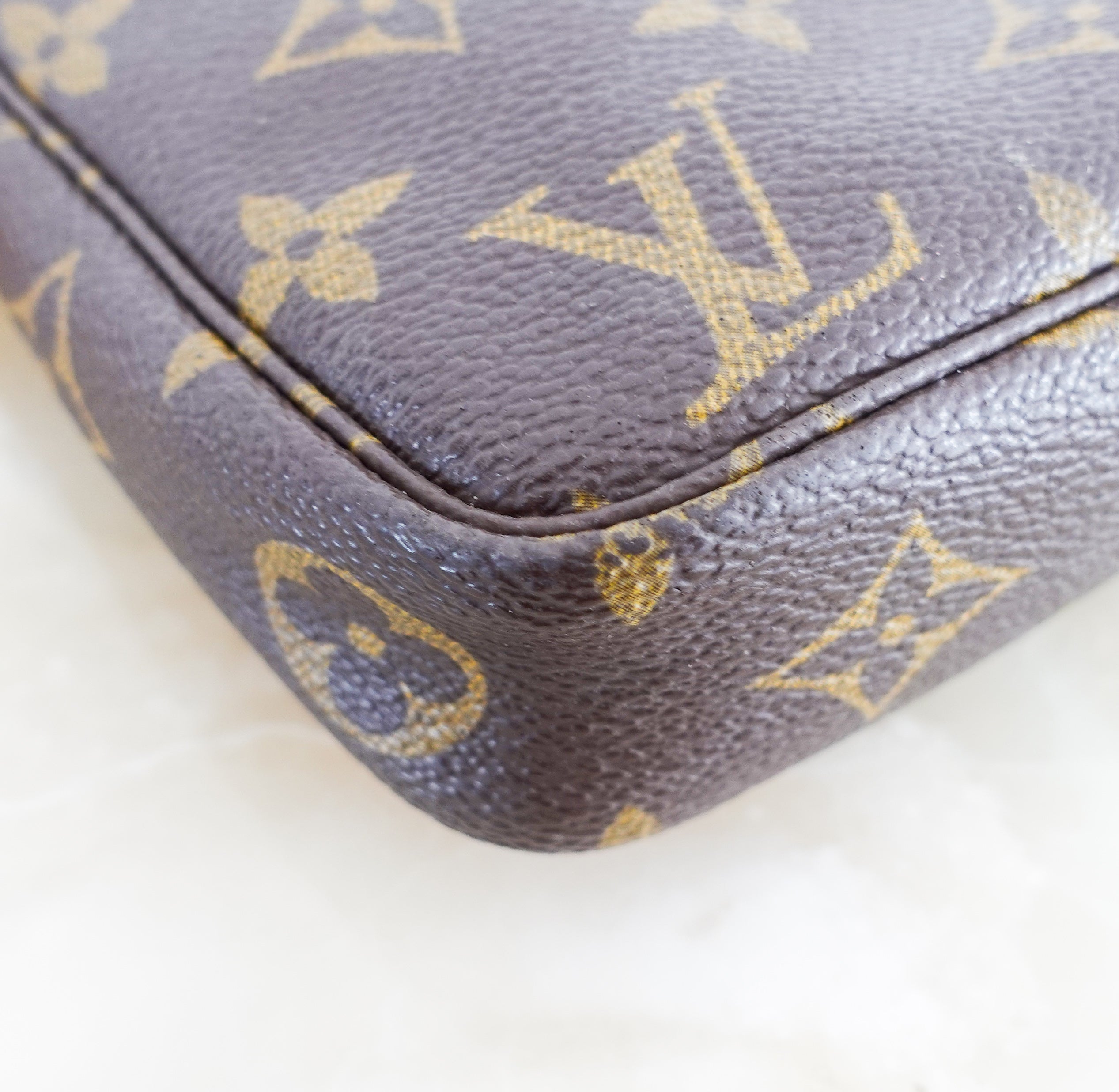 Monogram coated canvas clutch pouchette