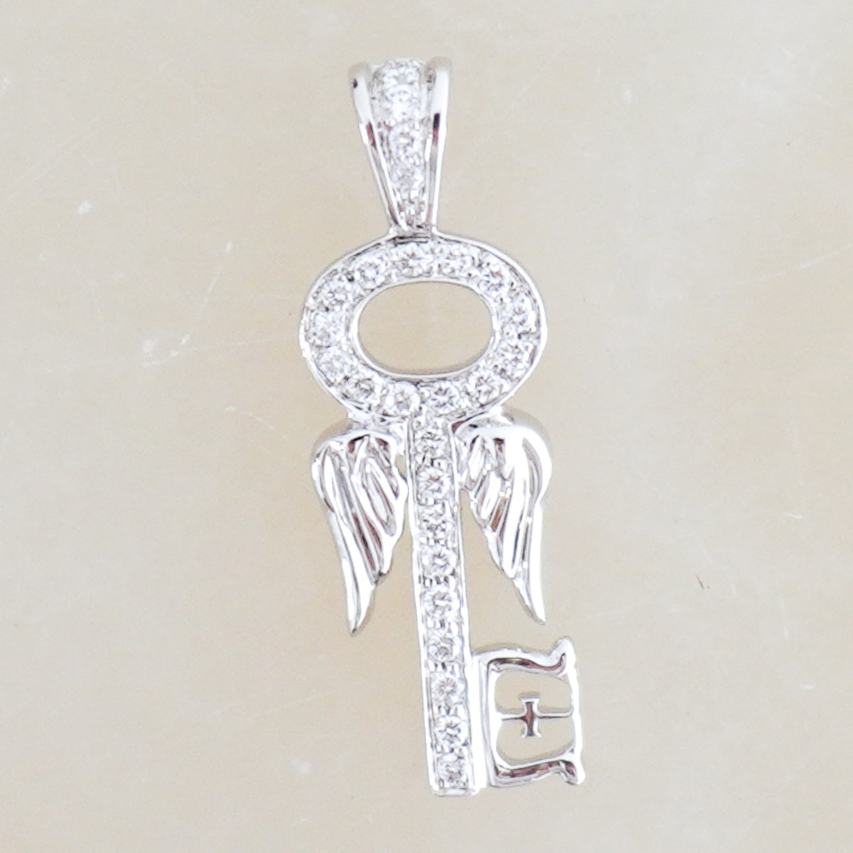 Front Image: Theo Fennell Diamond Key Charm Chelsea London