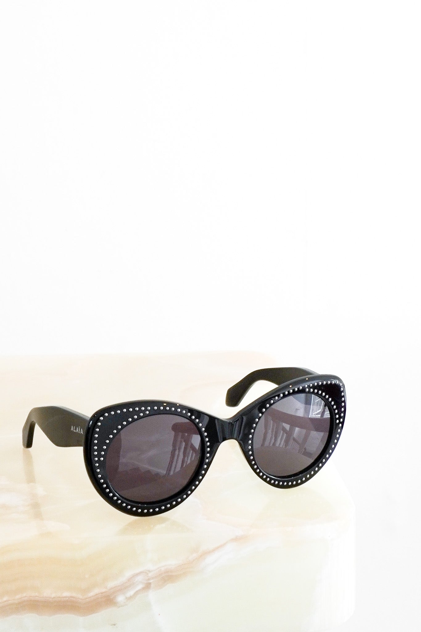 Front image Alaïa Black Round Acetate Sunglasses with Stud Detail Chelsea London
