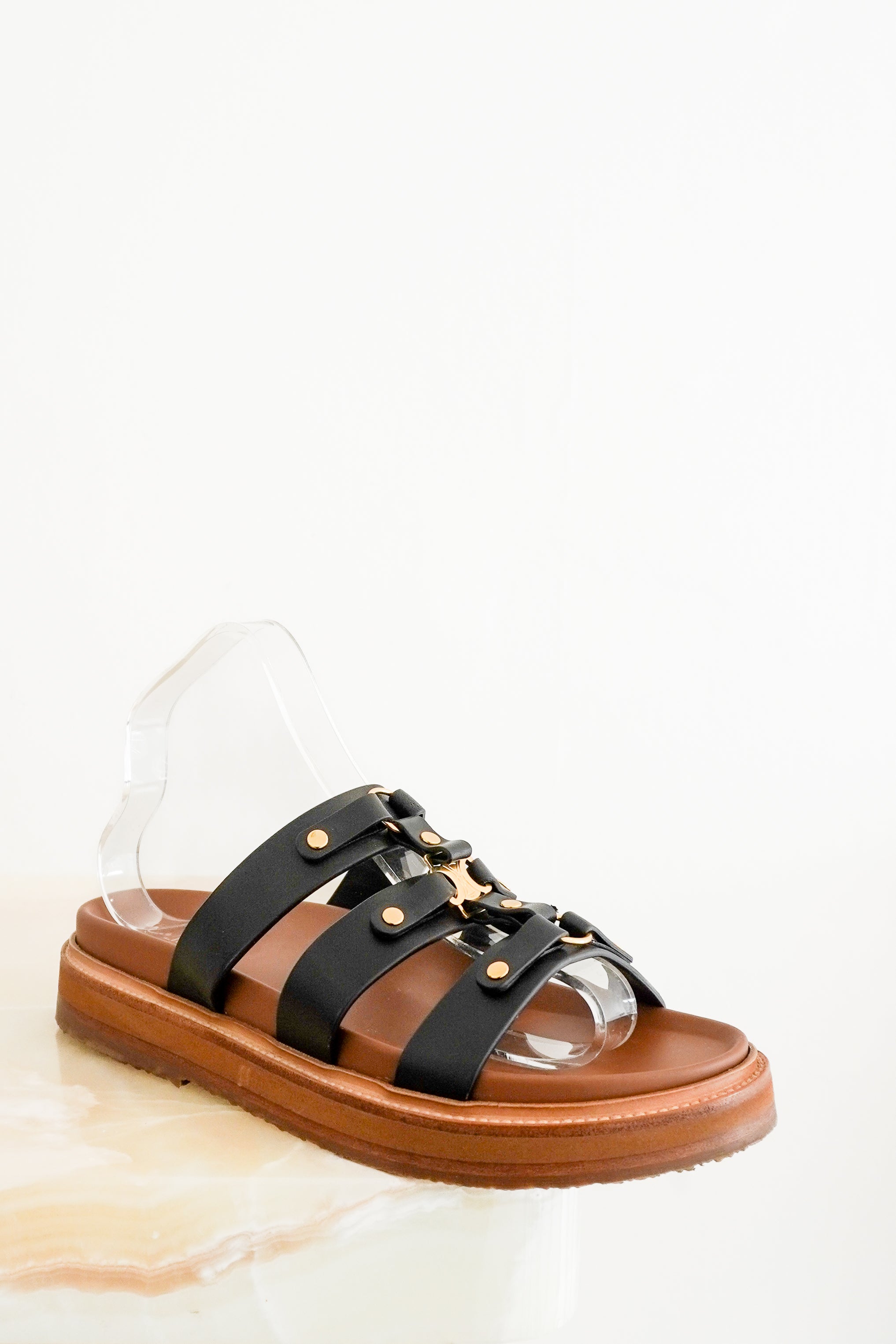 Front image of the CURRENT SEASON Celine Triomphe Tippi Slides Chelsea London
