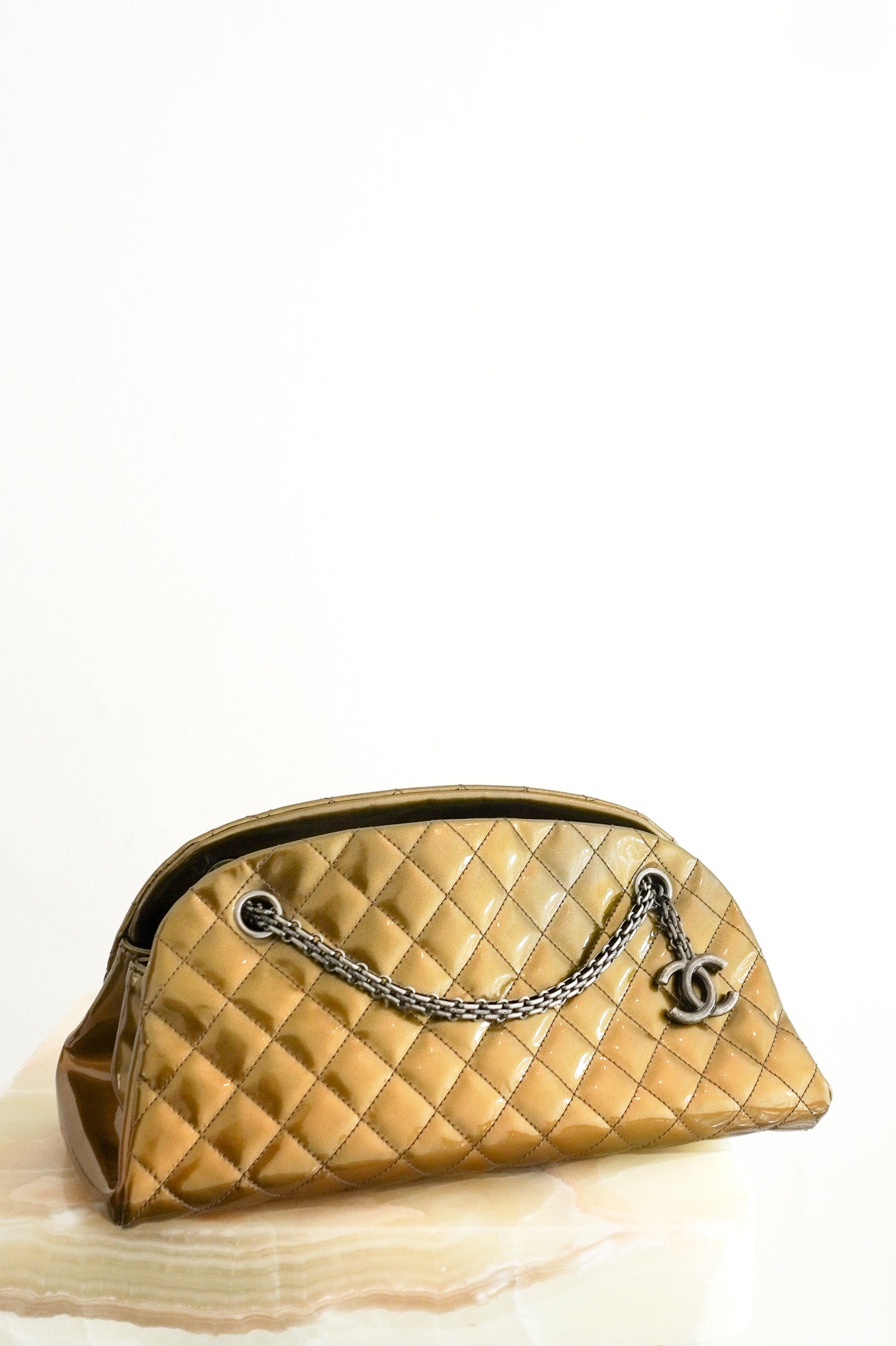 Front image of the Chanel Just Mademoiselle Patent Quilted Bag in Metallic Olive Green Chelsea London