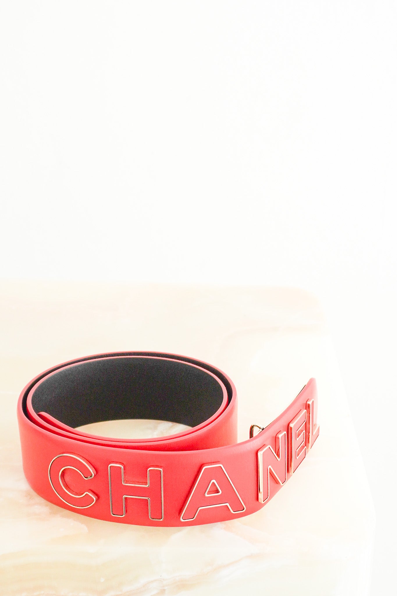 Front image of the Chanel Logo Letter Belt in Red Calfskin Leather 