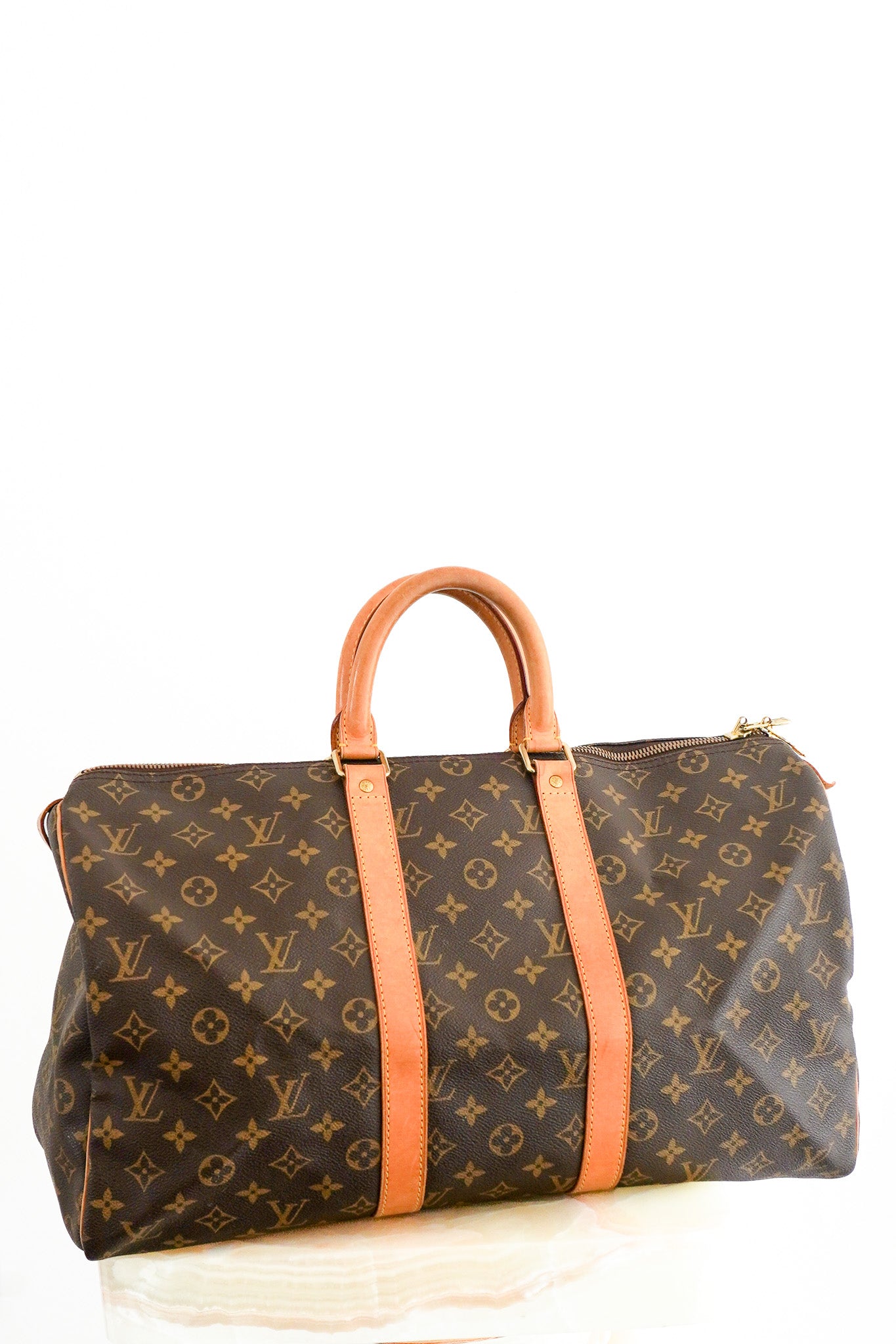 Front image of the Louis Vuitton Keepall Bandoulière 45 in Brown Monogram Canvas with Vachetta Leather Chelsea London