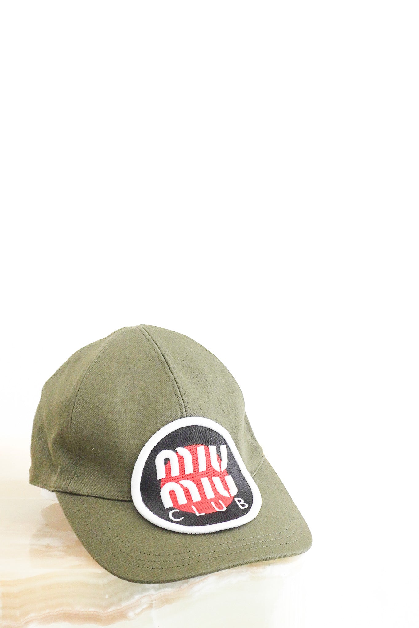 Front image of the Miu Miu Cap in Khaki Chelsea London
