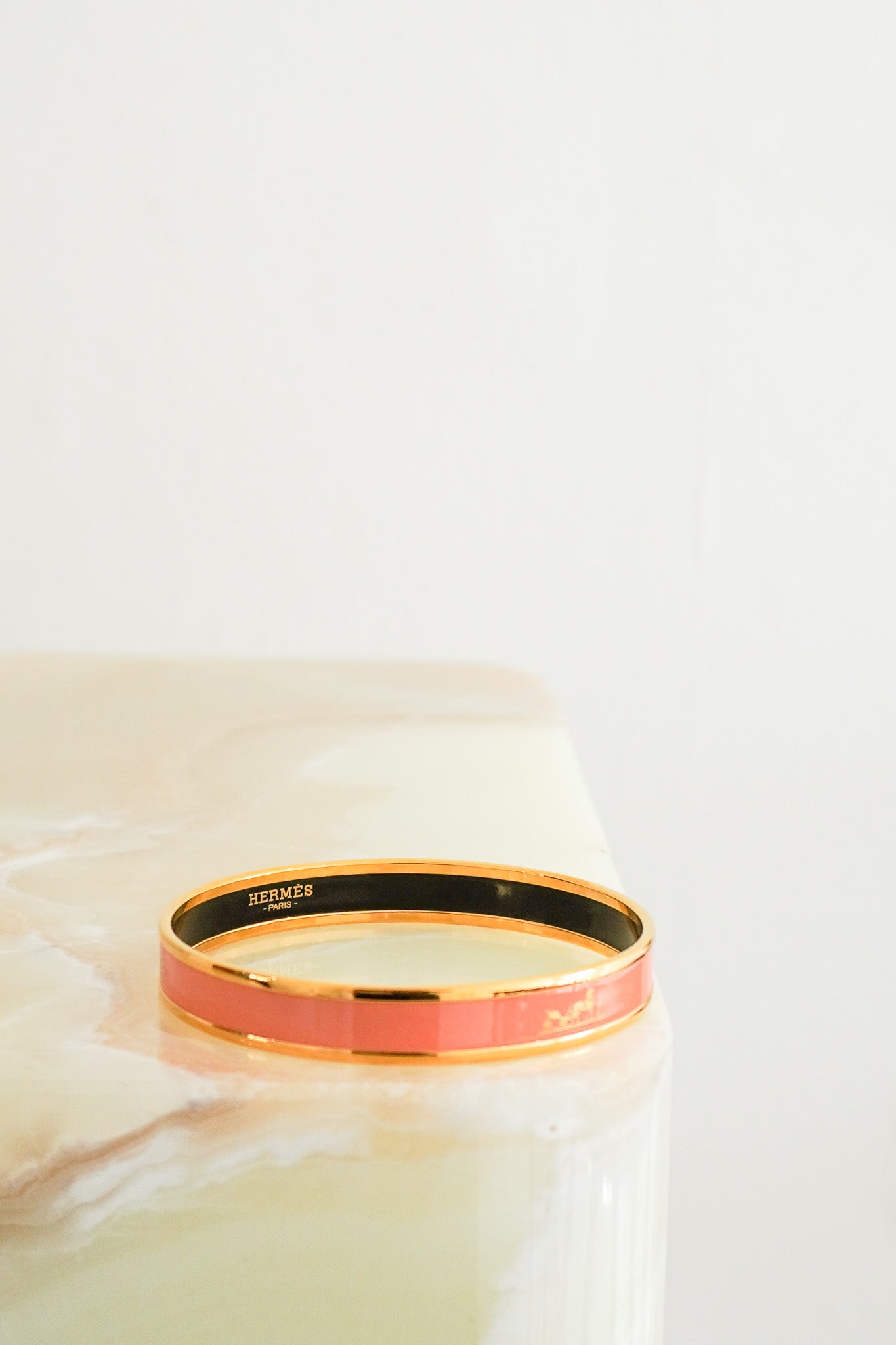 Front images of the Hermes Pink Enamel Bracelet in Gold Plated Metal Chelsea London
