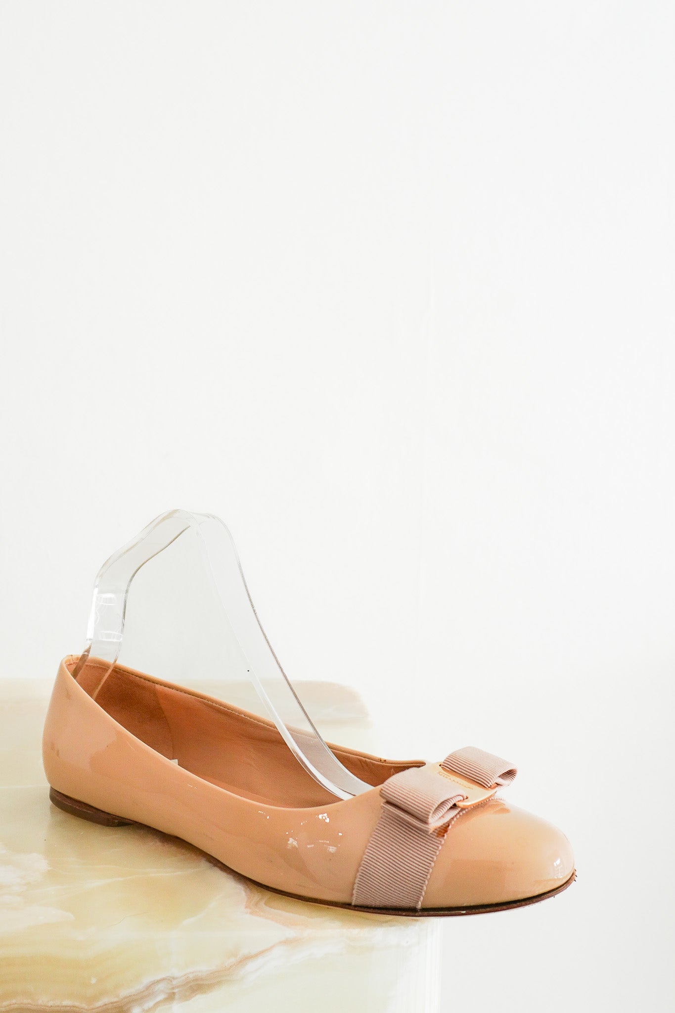 Front photo of the Ferragamo Tan Patent Bow Pumps Chelsea London