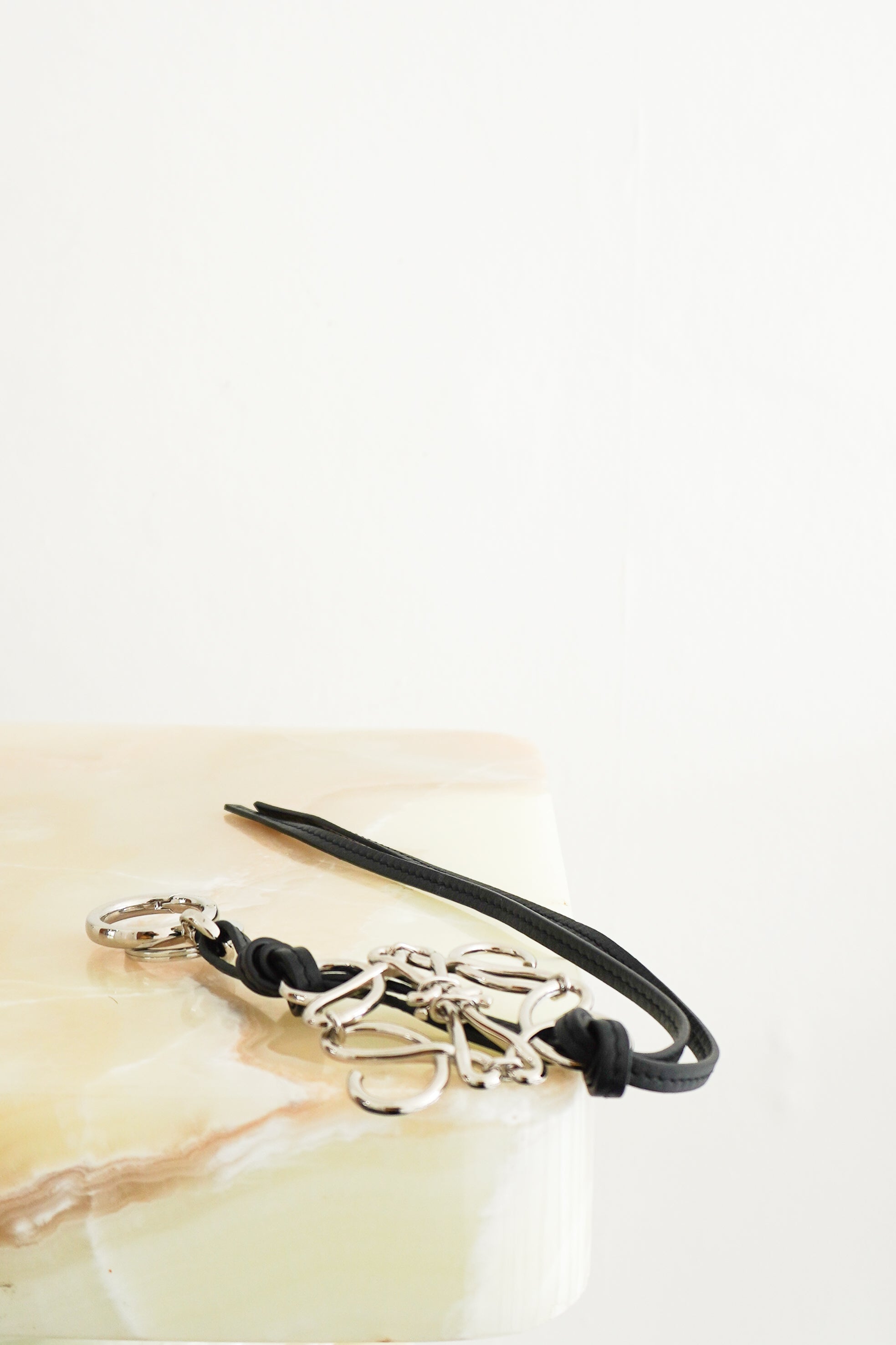 Loewe Black Leather & Silver Anagram Bag Charm front photo chelsea london