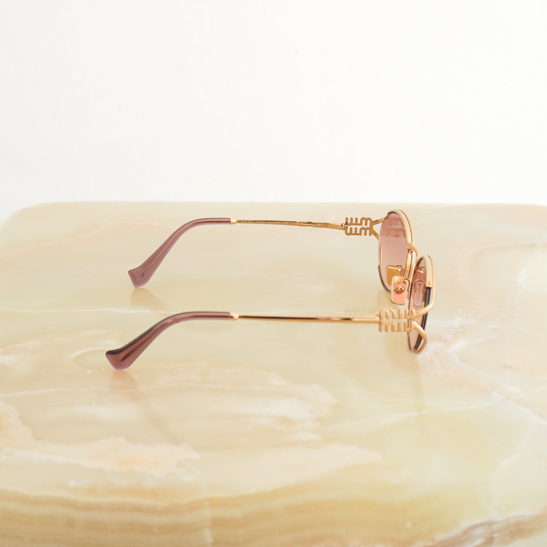 Miu Miu Logo Oval Pink & Gold Metal Sunglasses SMU52Y side photo chelsea london