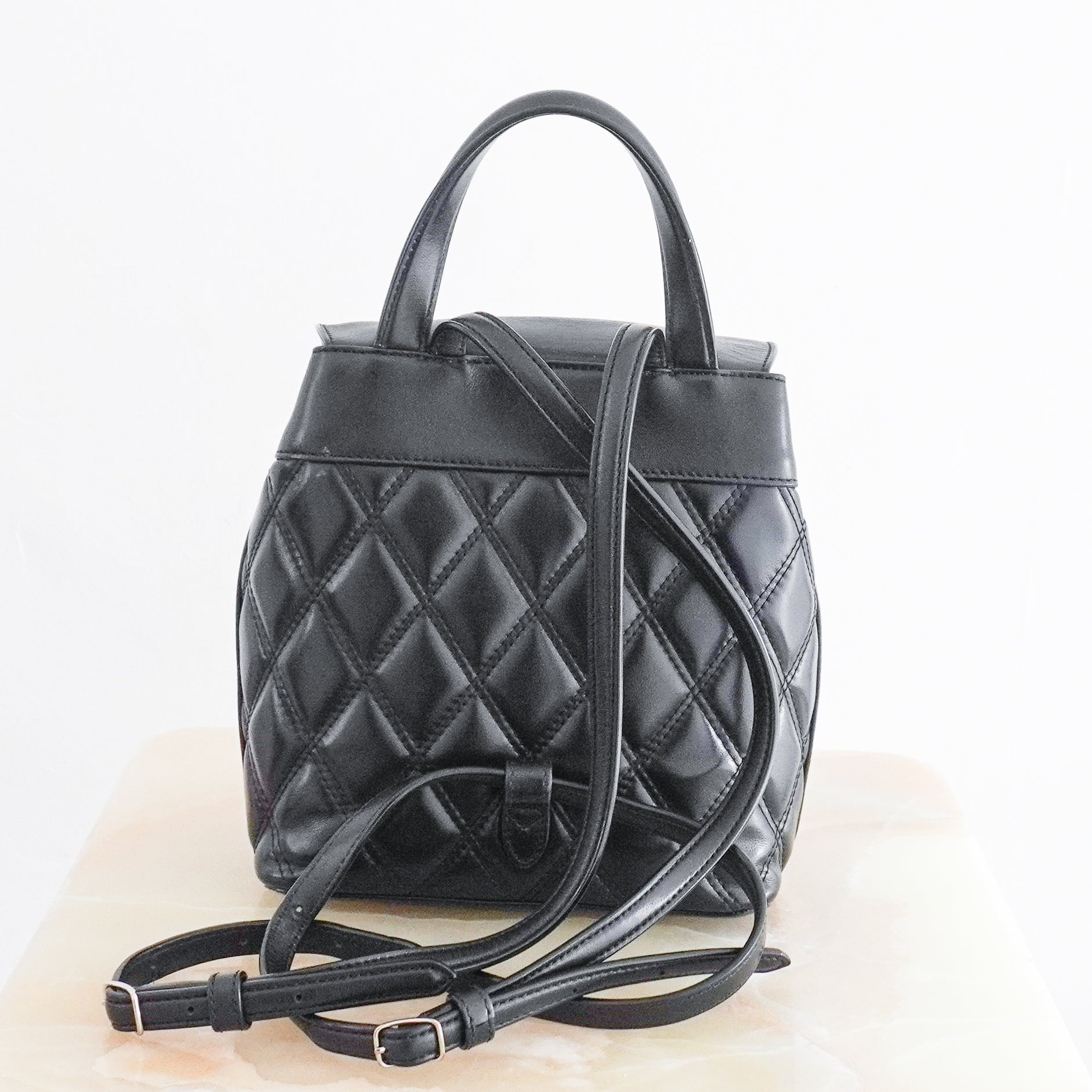 Mulberry Black Quilted Mini Backpack crafted in England from beautifully soft black leather with an all-over quilted finish and postman's lock.