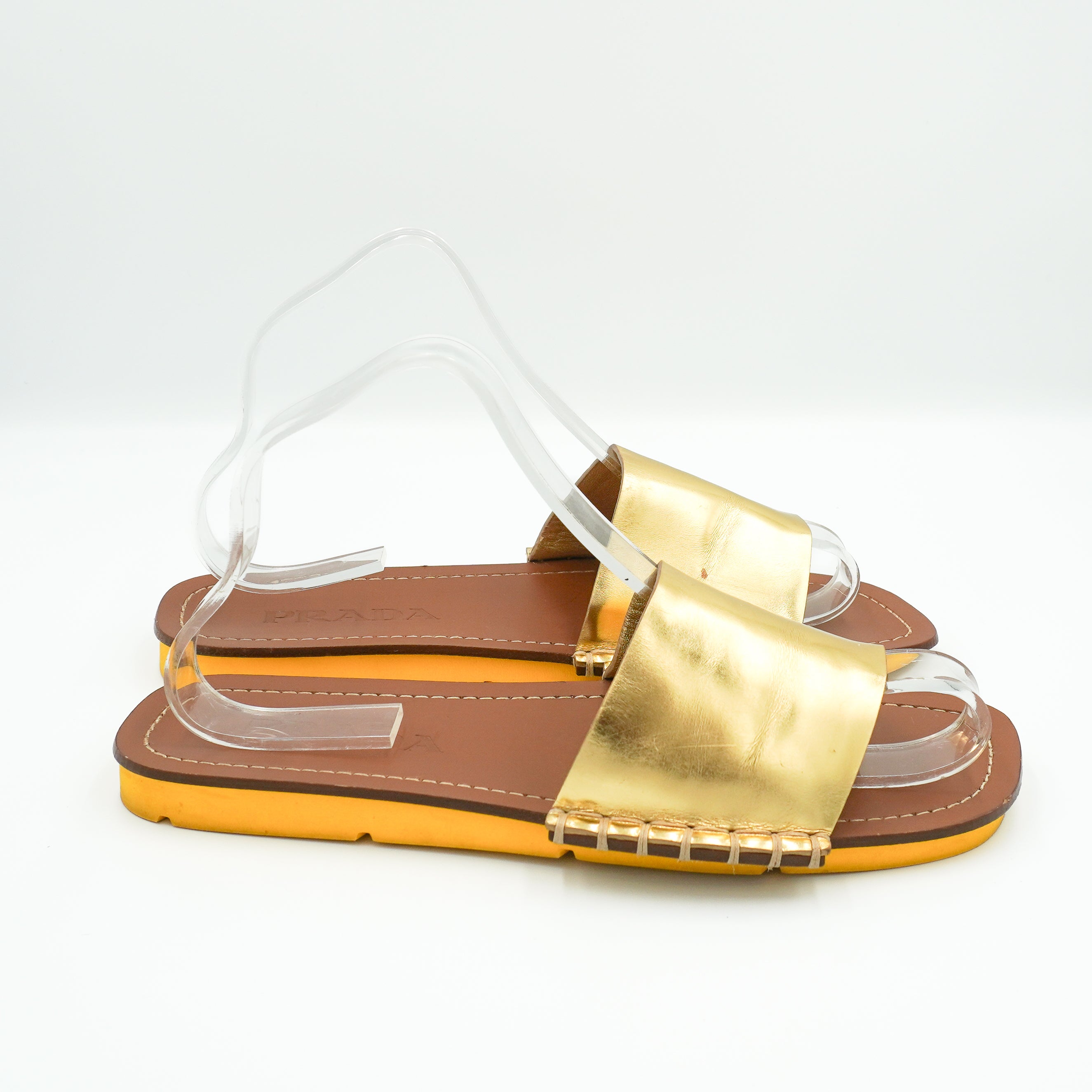 Prada Lightning Metallic Leather Slide Sandals in Gold back photo chelsea london