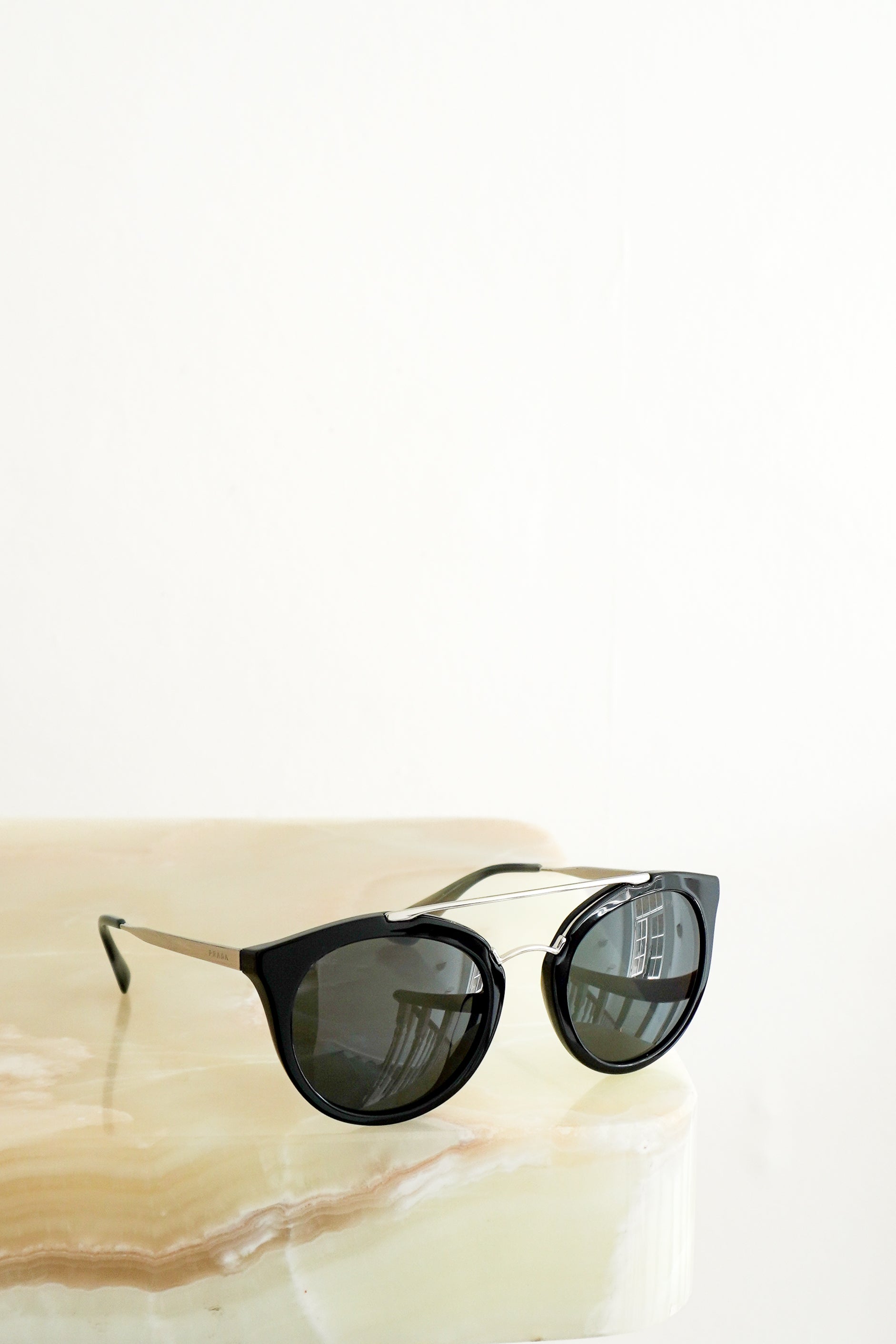 Prada PR 23SS Black Cat-Eye Sunglasses front photo chelsea london
