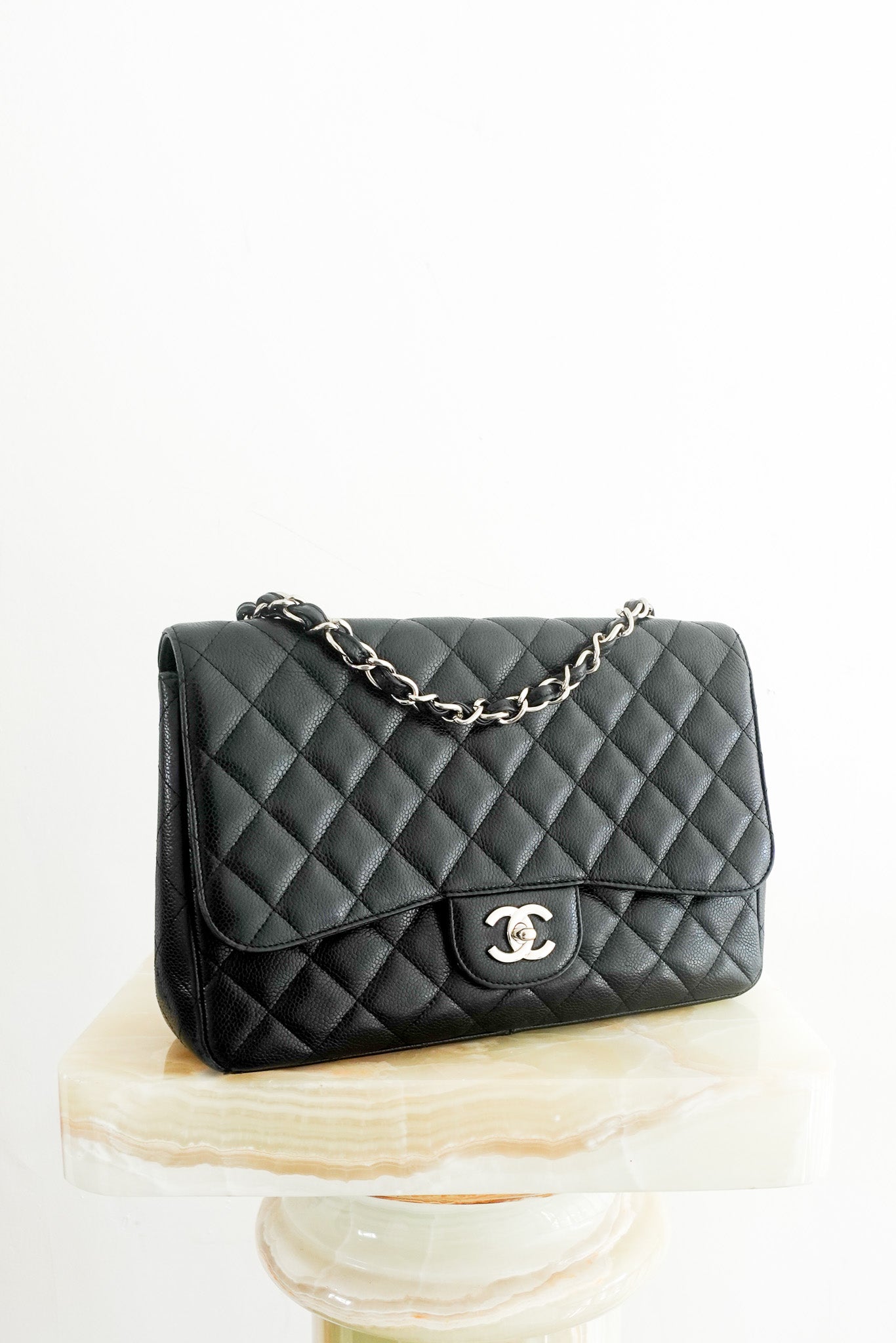 Preloved Chanel Jumbo Classic Single Flap in durable black Caviar leather with silver hardware. RRP £9.5K. 100% authentic with fast UK shipping.