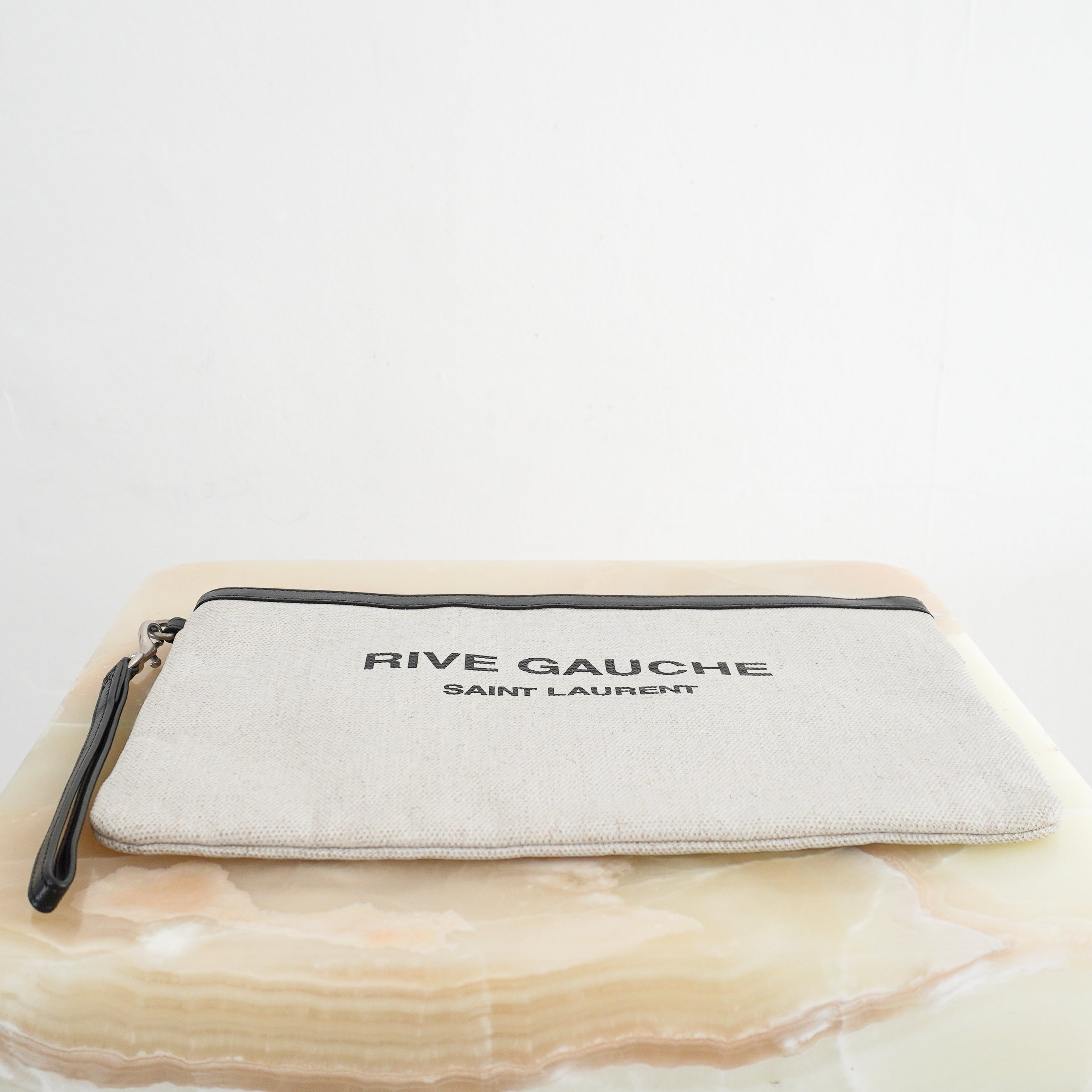 Saint Laurent Rive Gauche Zipped Pouch in Natural and Black bottom photo chelsea london