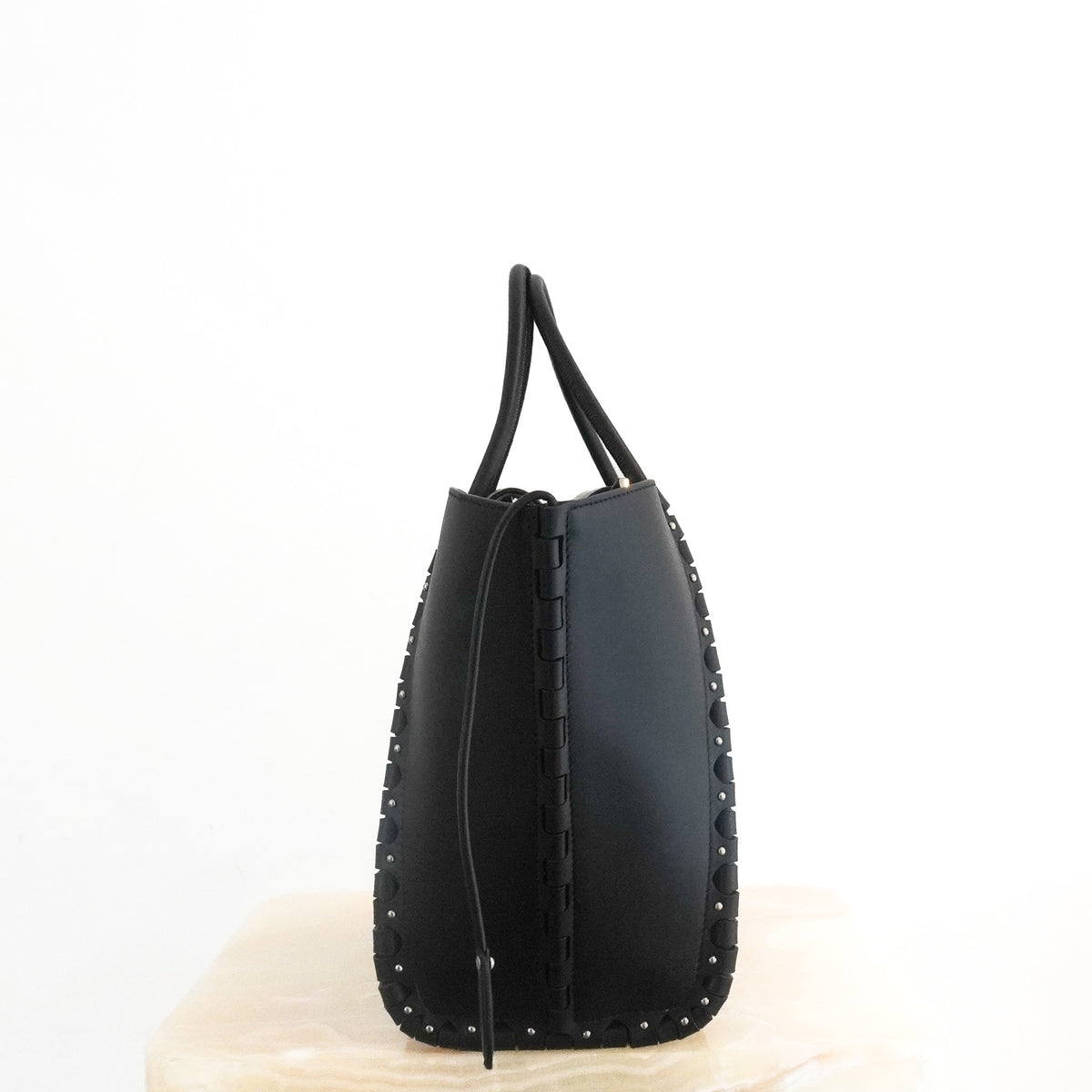 Side: Alaïa Le Hinge Small Black Leather Tote Bag