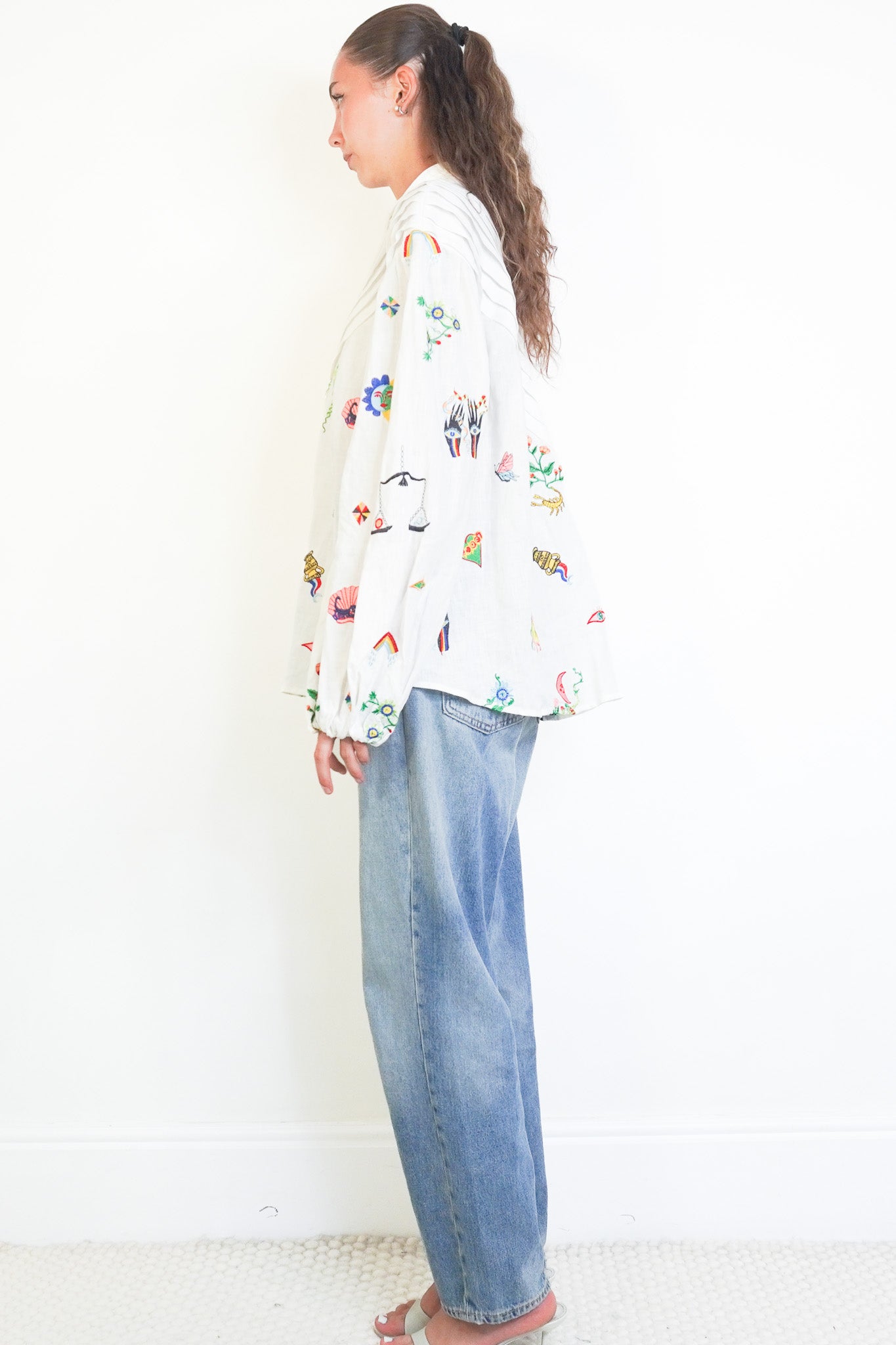 Side image of the Alémais White Linen Embroidered Blouse