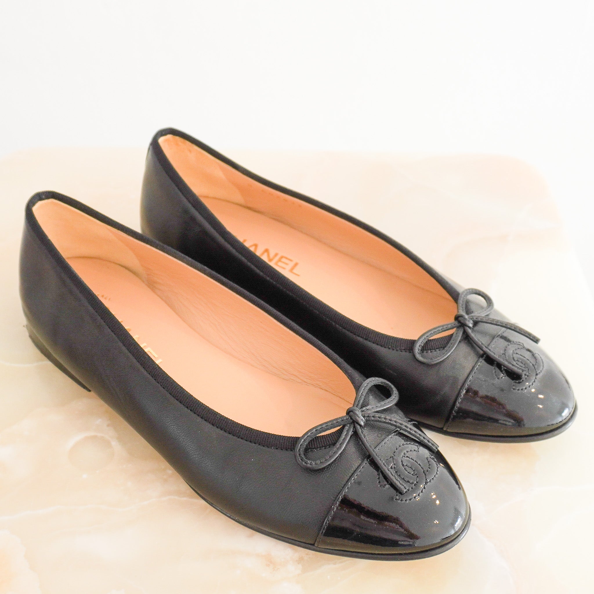Side image of the CHANEL Black Cap-Toe Ballet Flats
