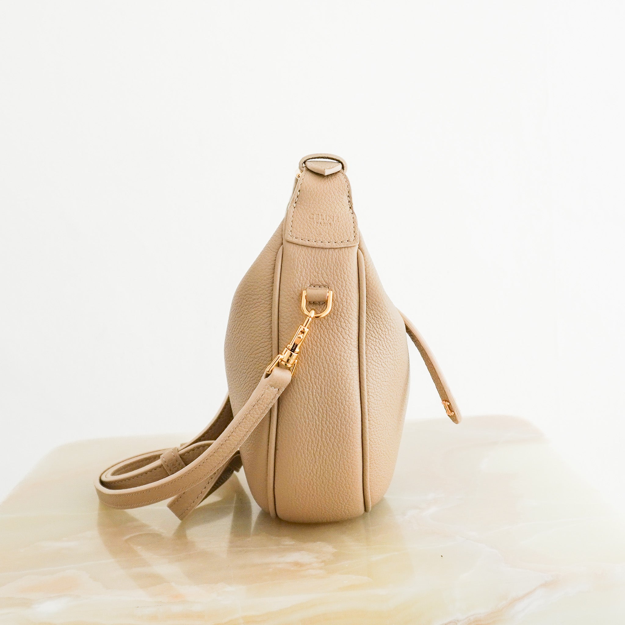 Side image of the Celine Teen Lulu Bag in Grained Calfskin