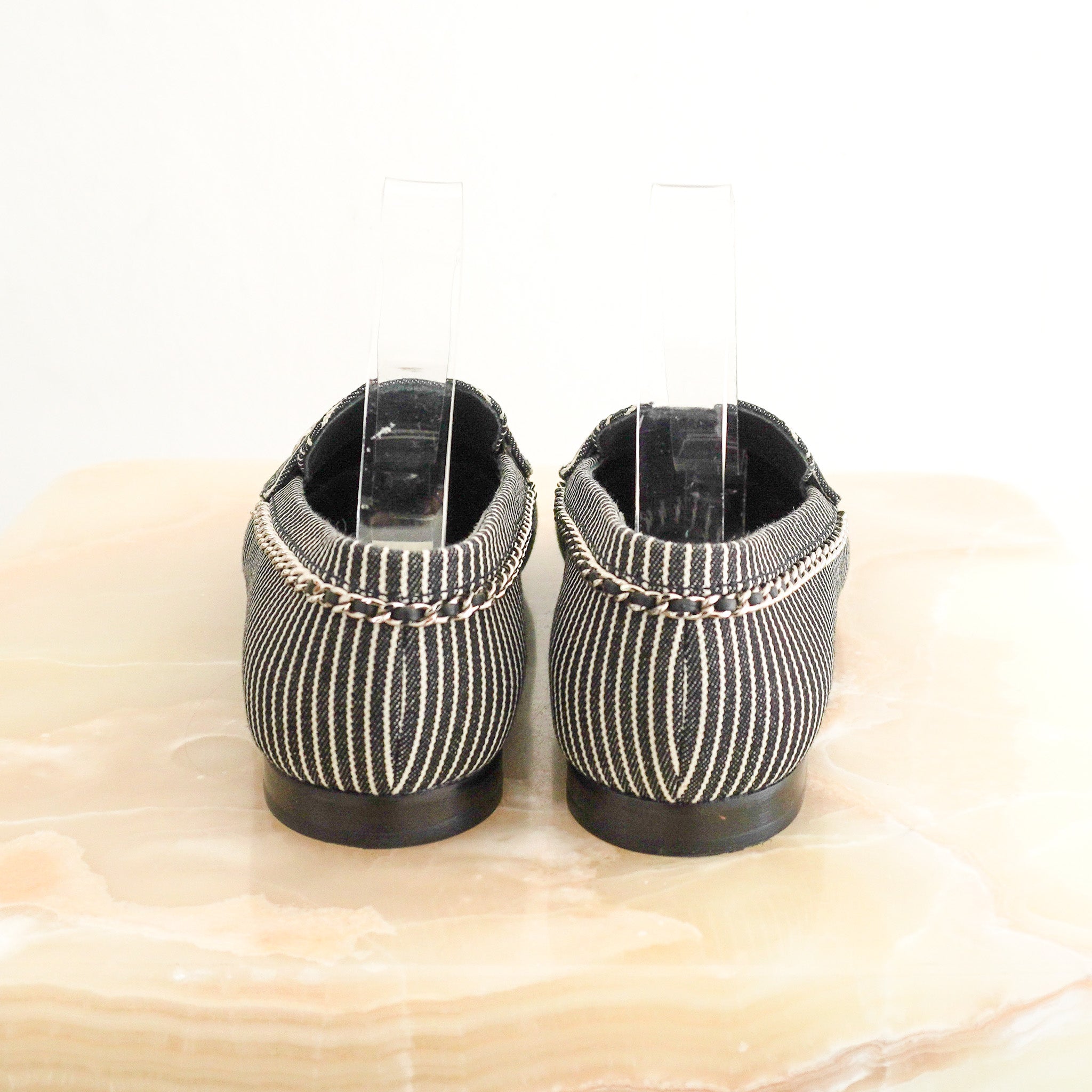 Side image of the Chanel Bicolor Denim Stripe CC Chain Moccasin Loafers 