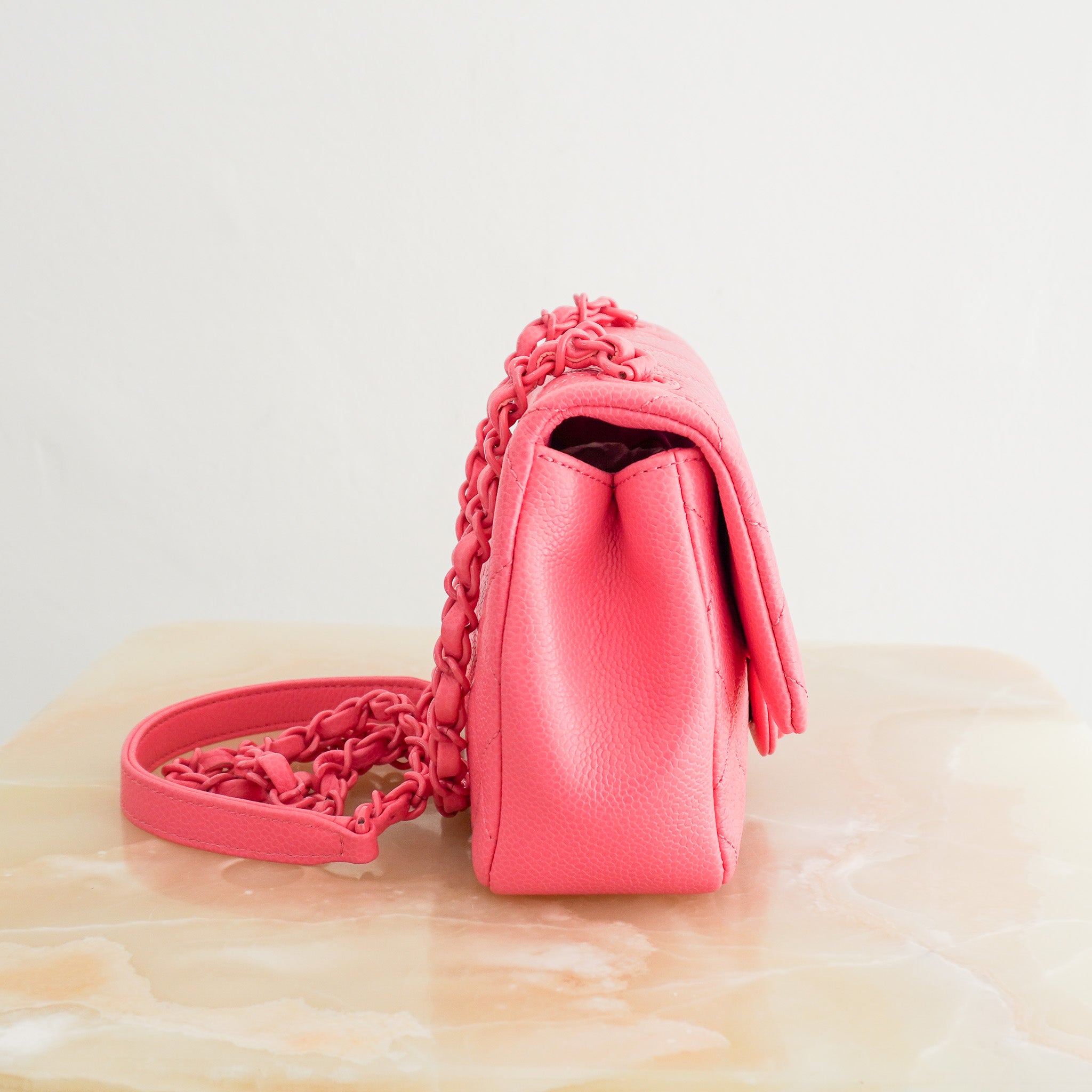Side image of the Chanel Incognito Mini Square Flap Bag in Monochrome Pink Caviar Leather and Hardware, 2019 