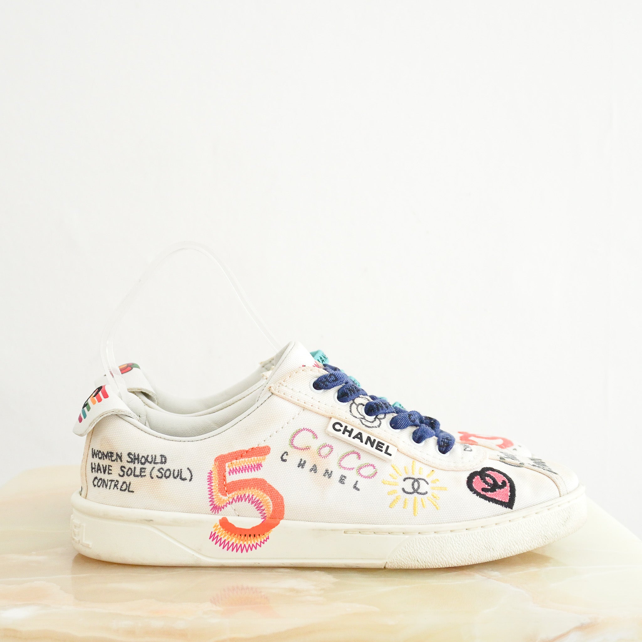 Side image of the Chanel x Pharrell White Multi Colour Sneakers 