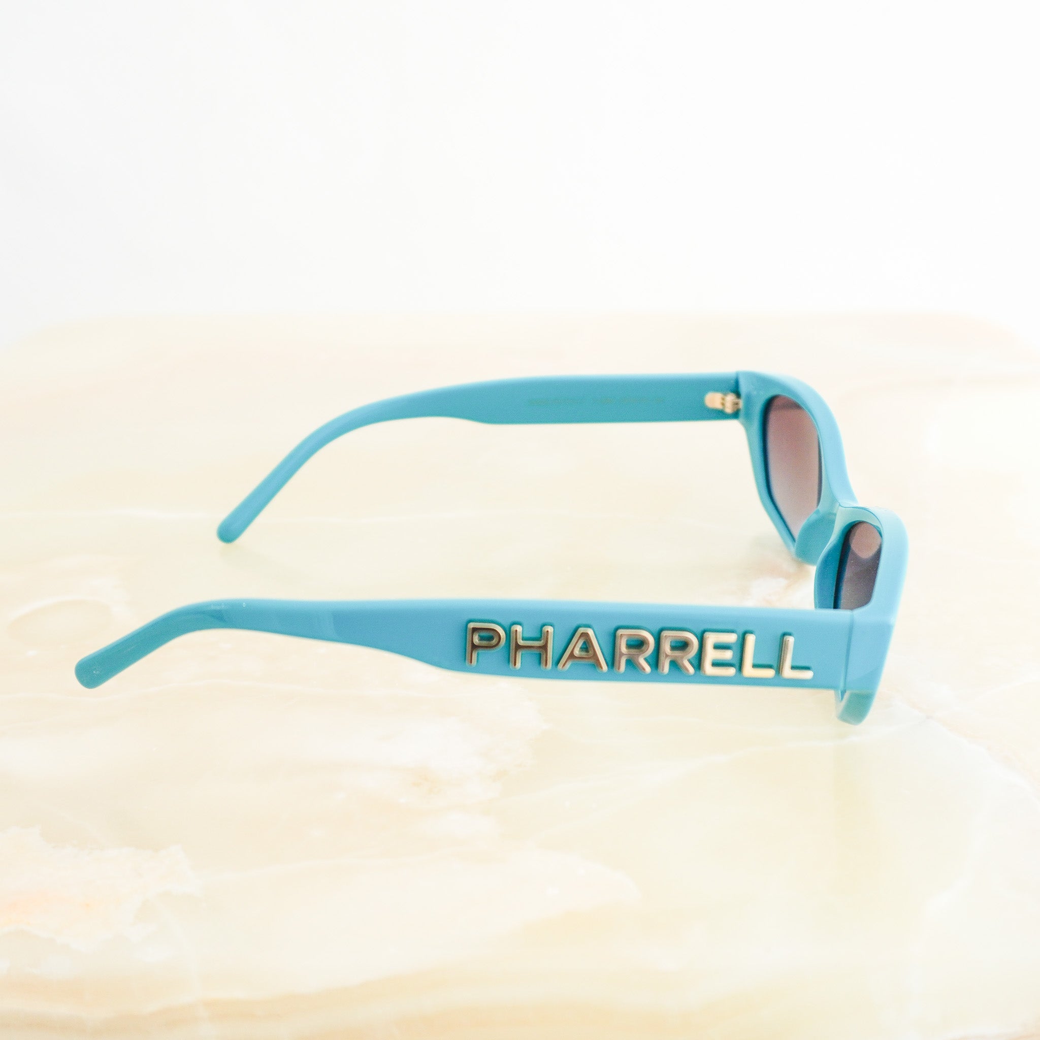 Side  image of the Chanel x Pharrell Williams Teal Sunglasses