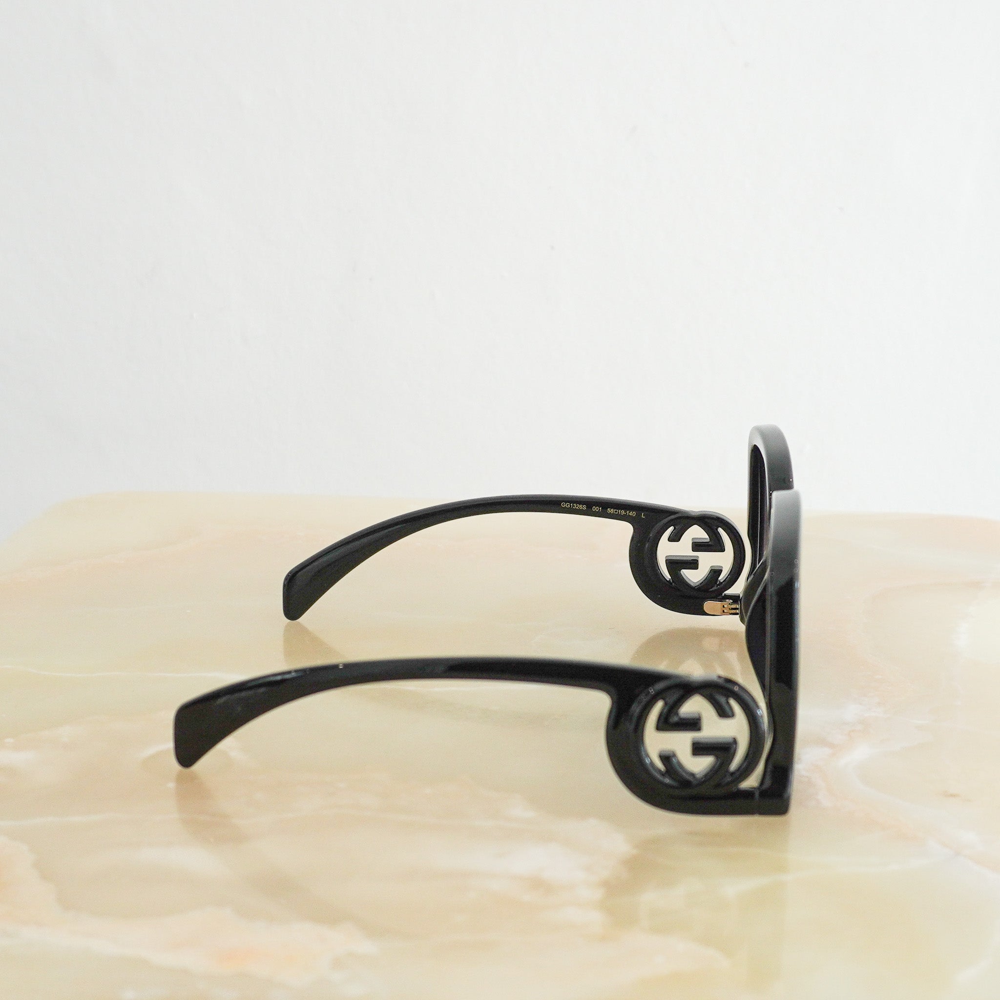 Side image of the Gucci Oversized Square Sunglasses in Black 