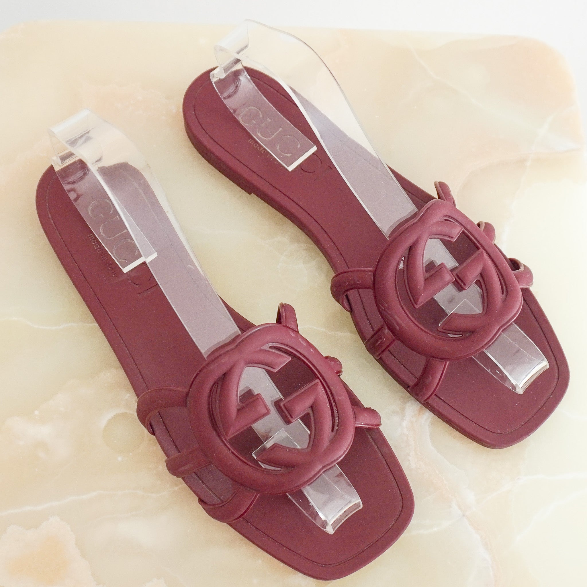 Side image of the Gucci Rubber Interlocking Rosso Ancora Burgundy Slides 