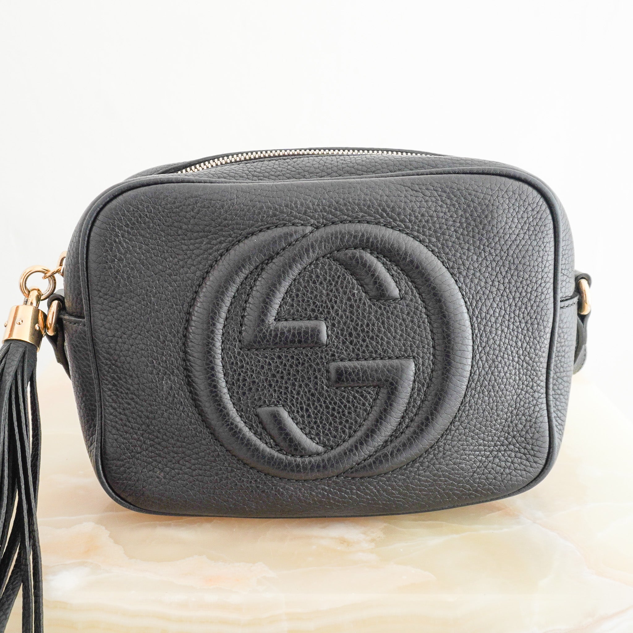 Side image of the Gucci Soho Disco Crossbody Bag in Black