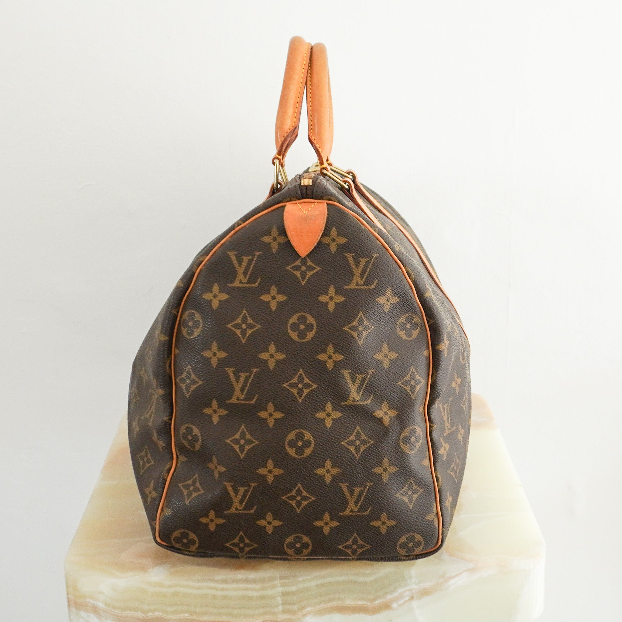  Side image of the Louis Vuitton Keepall Bandoulière 45 in Brown Monogram Canvas with Vachetta Leather