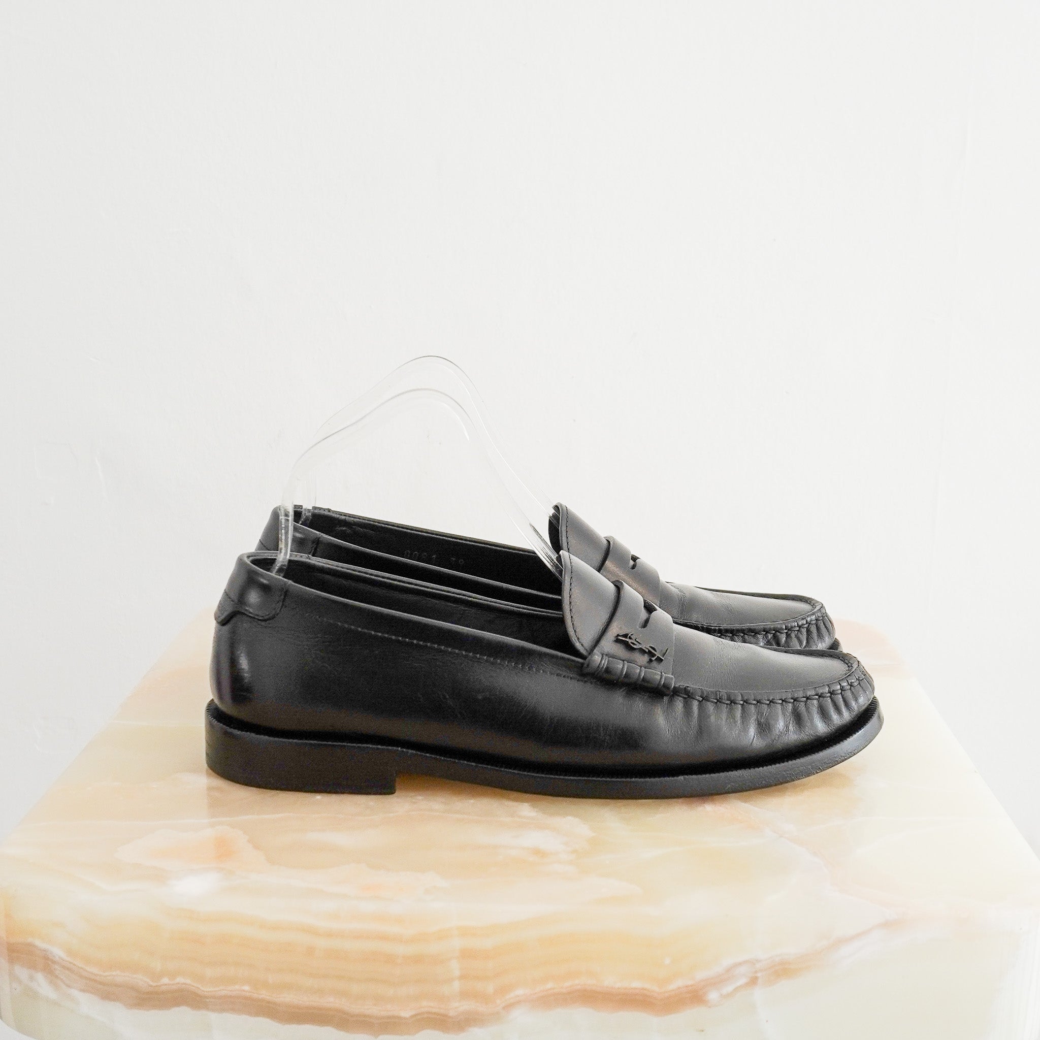 Side image of the Saint Laurent Penny Loafers in Black