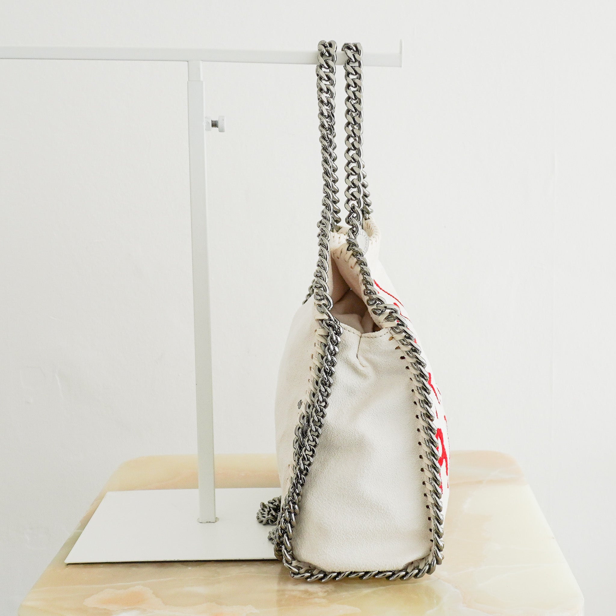 Side image of the Stella McCartney Graffiti Falabella Tote Bag