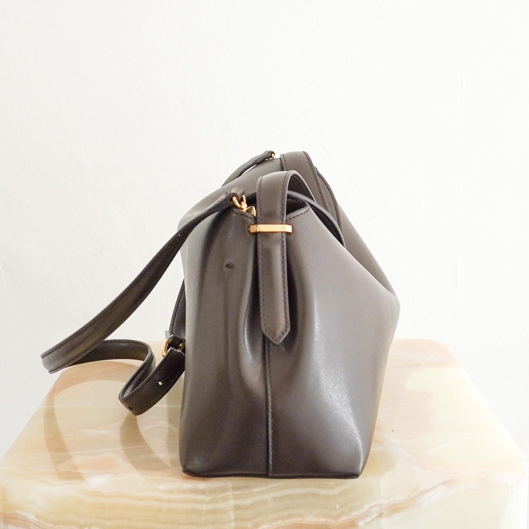 Side image of the Toteme T-Lock Top Handle Bark Bag 