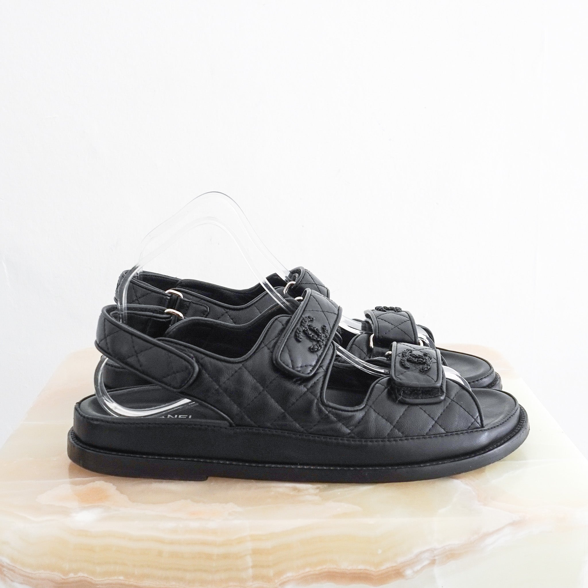 Side photo of the Chanel Black Quilted Leather Dad Sandals