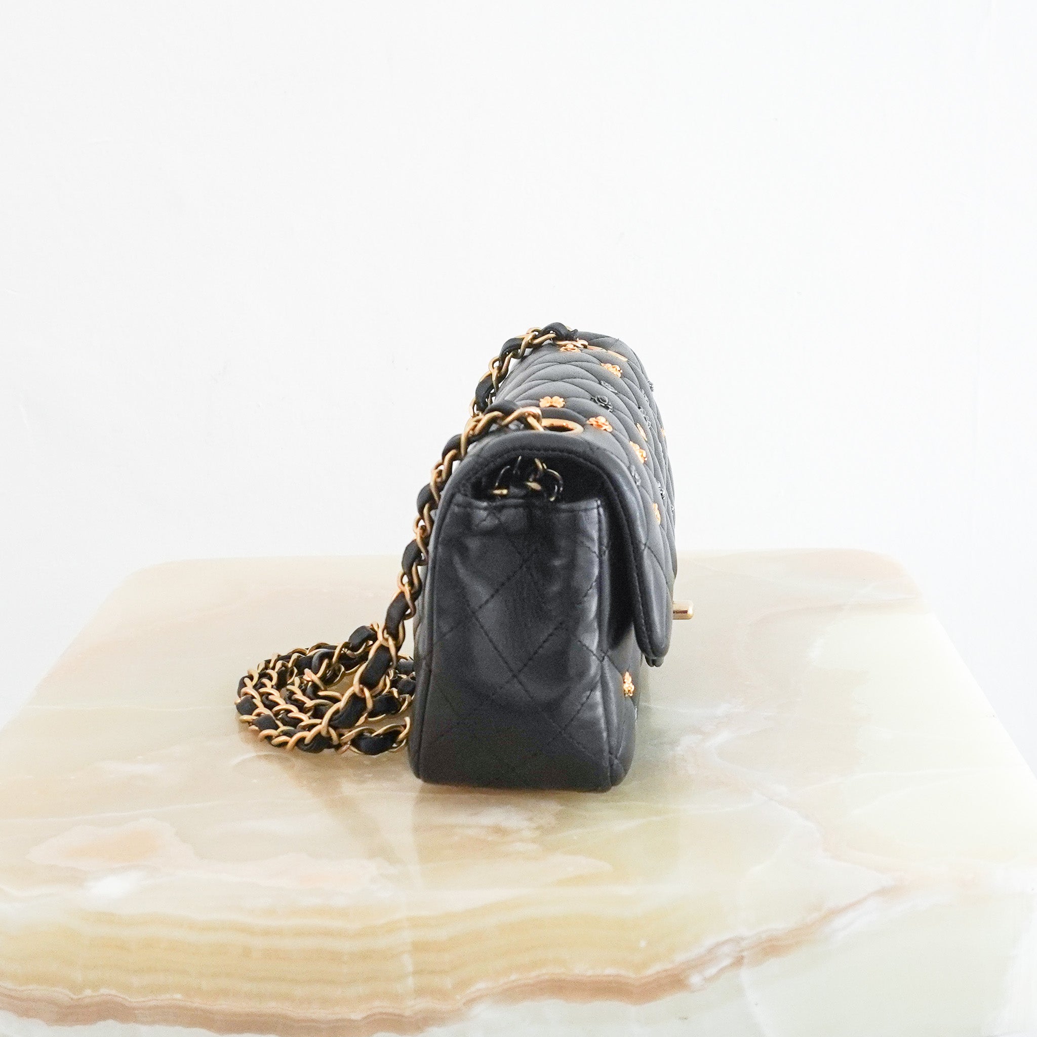 Side photo of the Chanel Mini Lucky Charms Rectangular Flap Bag in Black Lambskin 