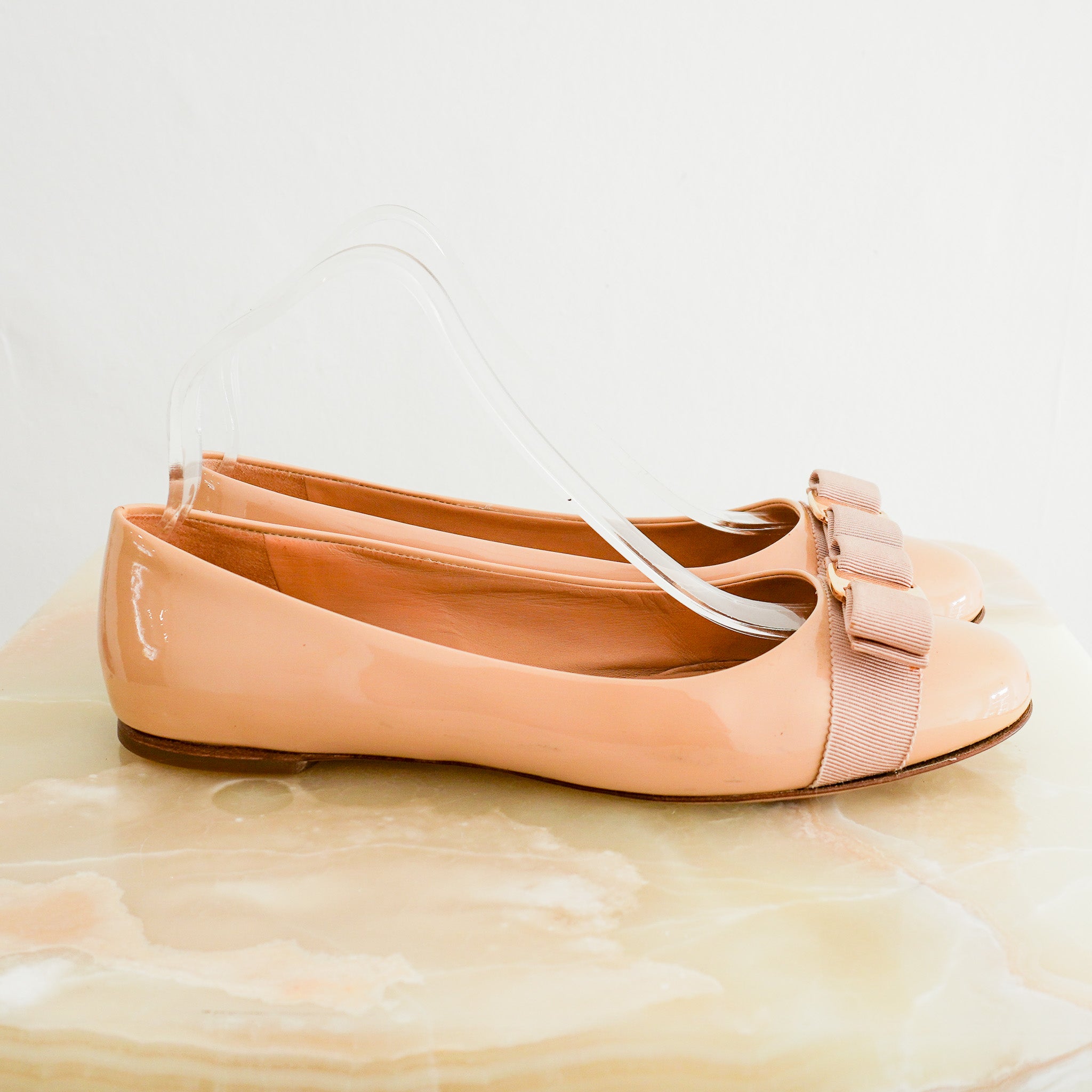 Side photo of the Ferragamo Tan Patent Bow Pumps