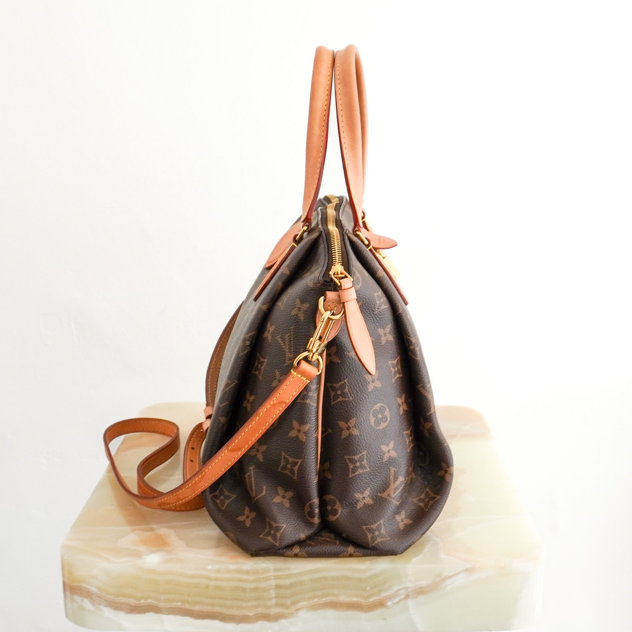 Side photo of the Louis Vuitton Petite Rivoli Moyen Modèle Tote Bag