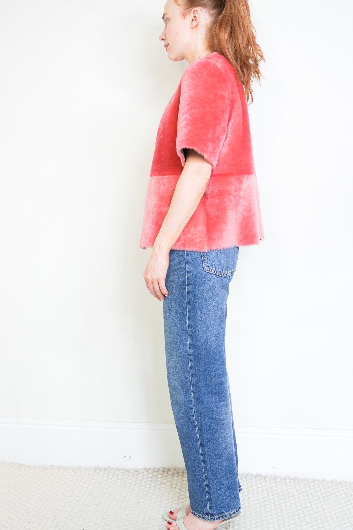 Side photo of the Stone and Waisted Jeanette Pink Shearling Jacket 