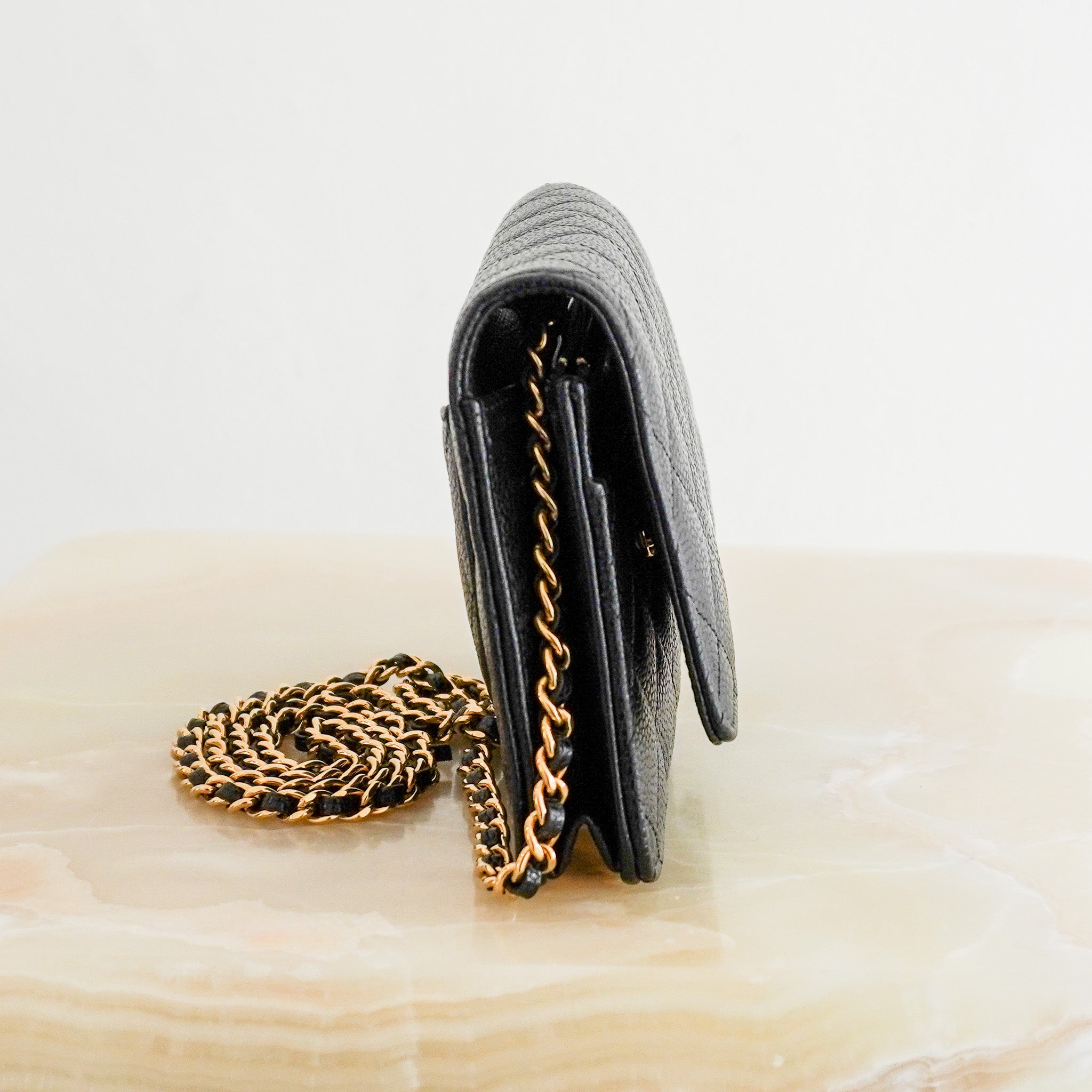 Side picture of the Chanel Wallet on Chain Black Caviar Leather & Gold Hardware