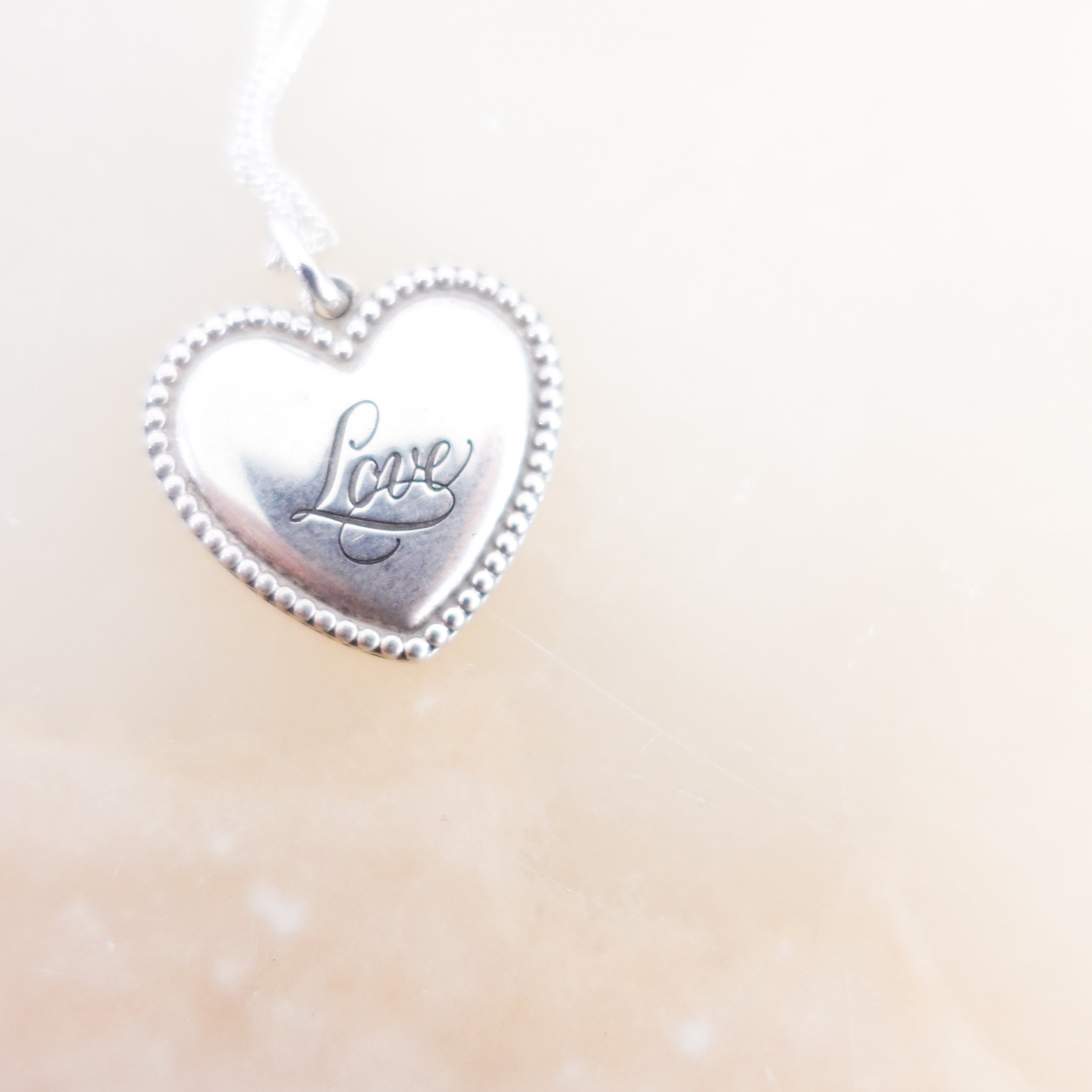 Tiffany-&-Co-Engraved-Love-Pendant-Necklace-close-picture-Chelsea-London