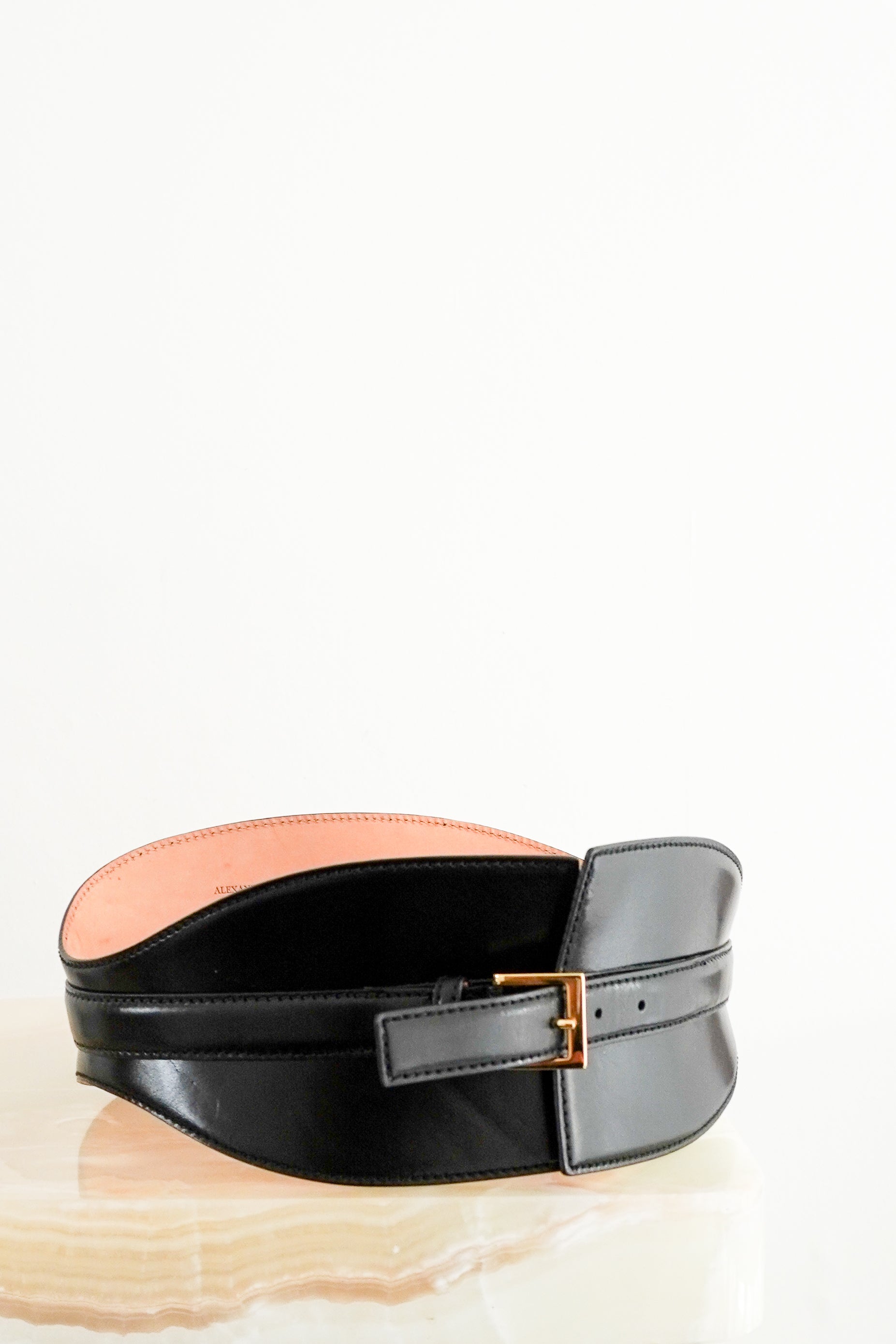 Front image of the Alexander Mcqueen Corset belt showing the leather and asymmetric edge