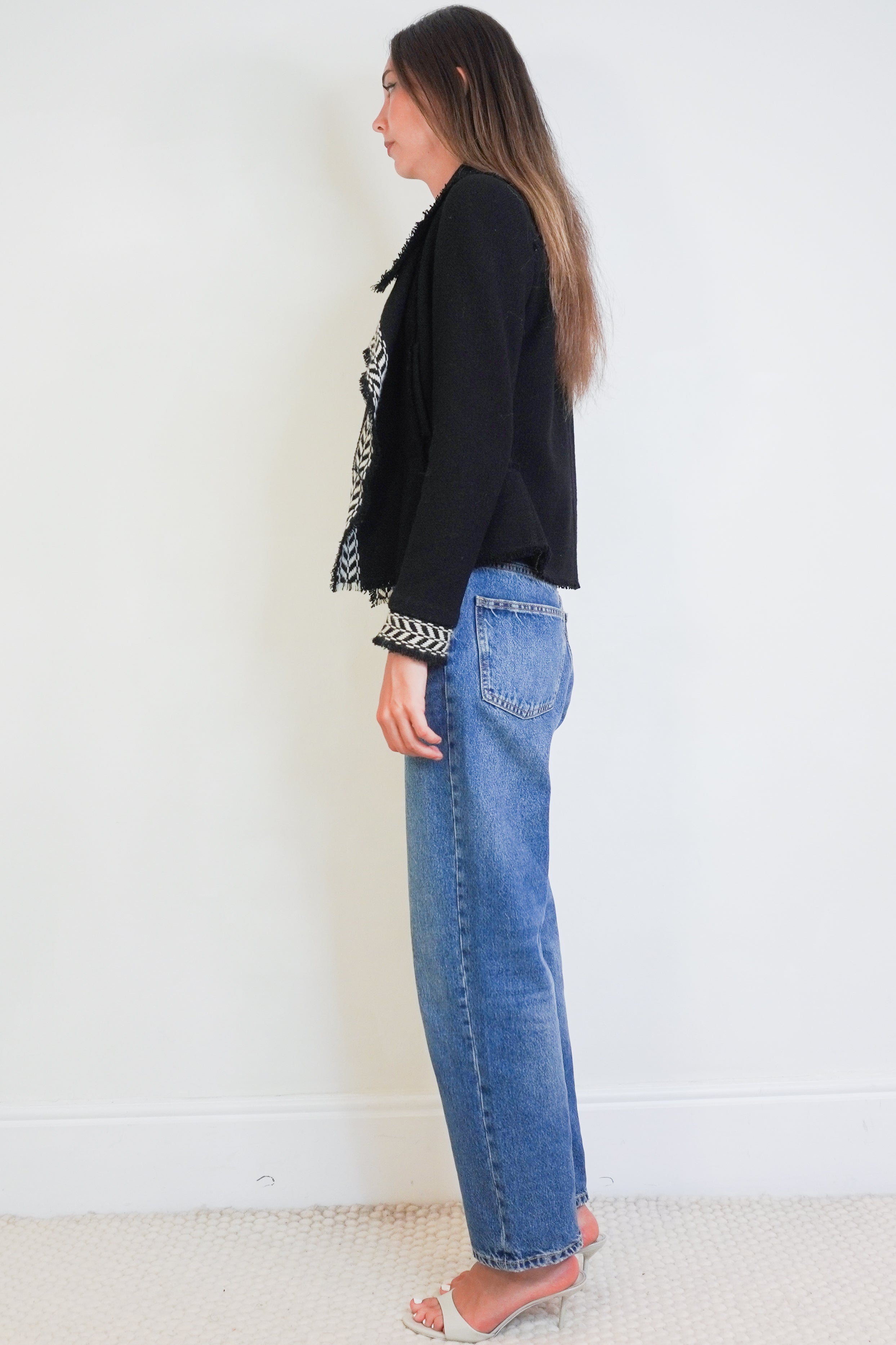 Side Picture of Chanel Black Jacket.
