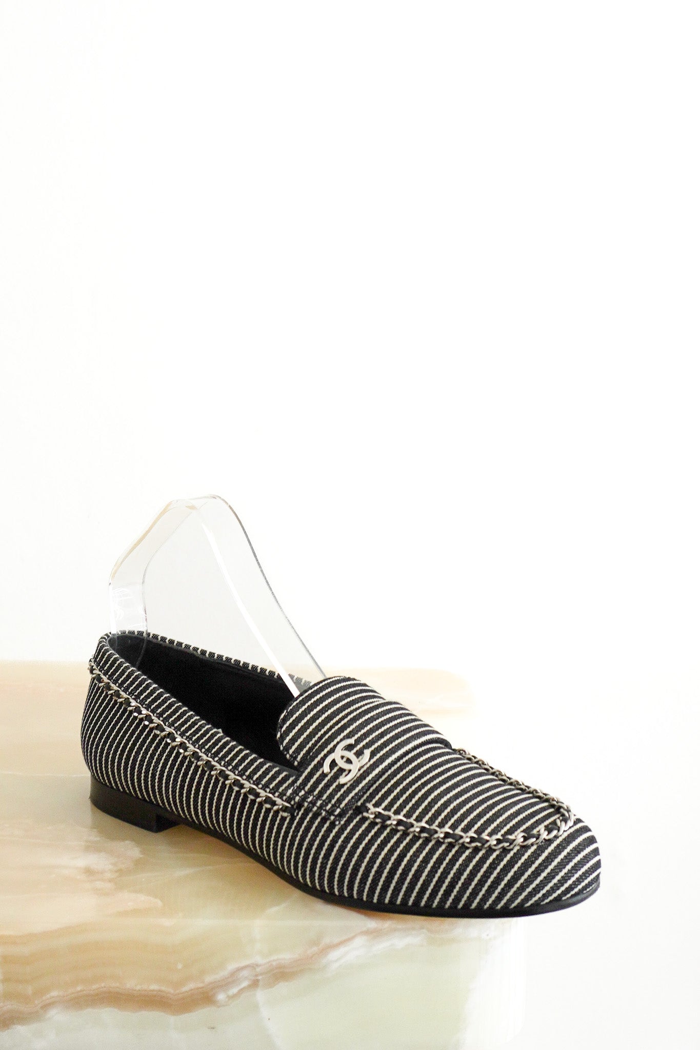 front image of the Chanel Bicolor Denim Stripe CC Chain Moccasin Loafers 