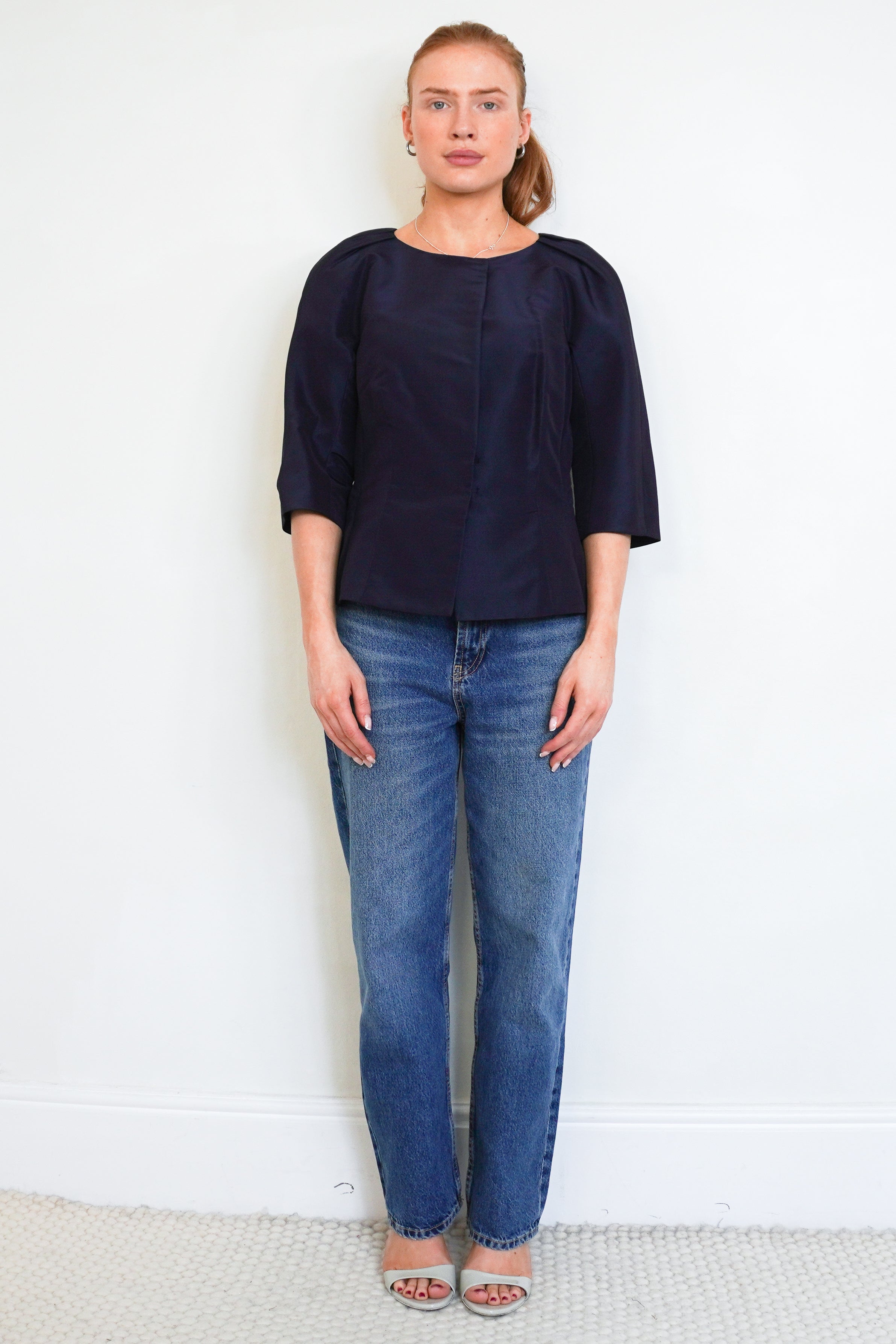 Front picture of the Oscar De La Renta Top showing the neckline and fastening.