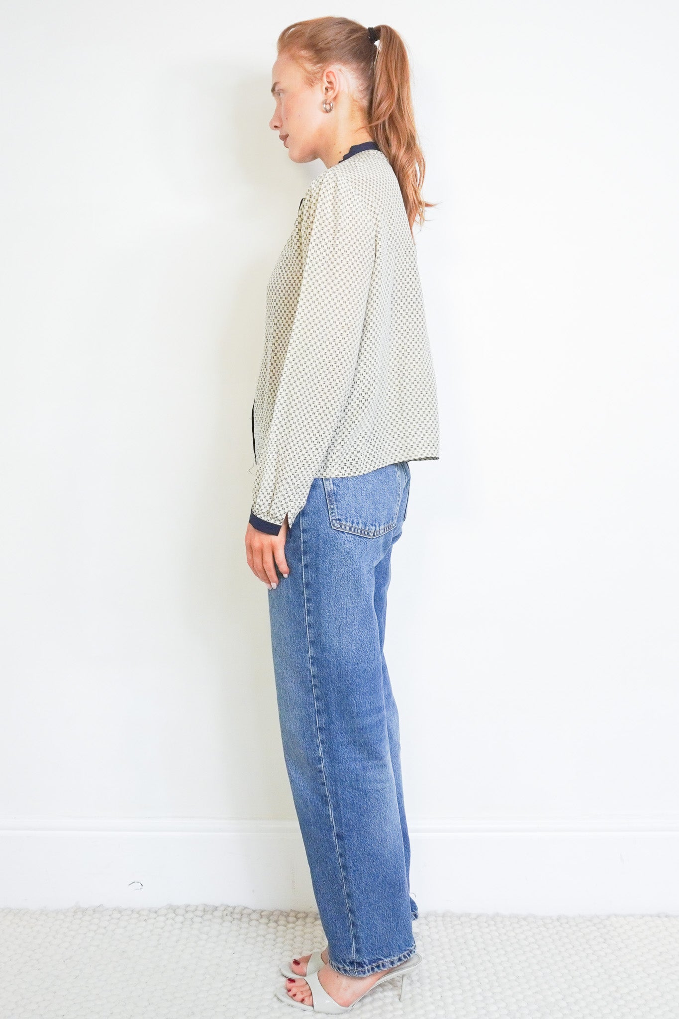 side image of the Chanel CC Silk Blouse