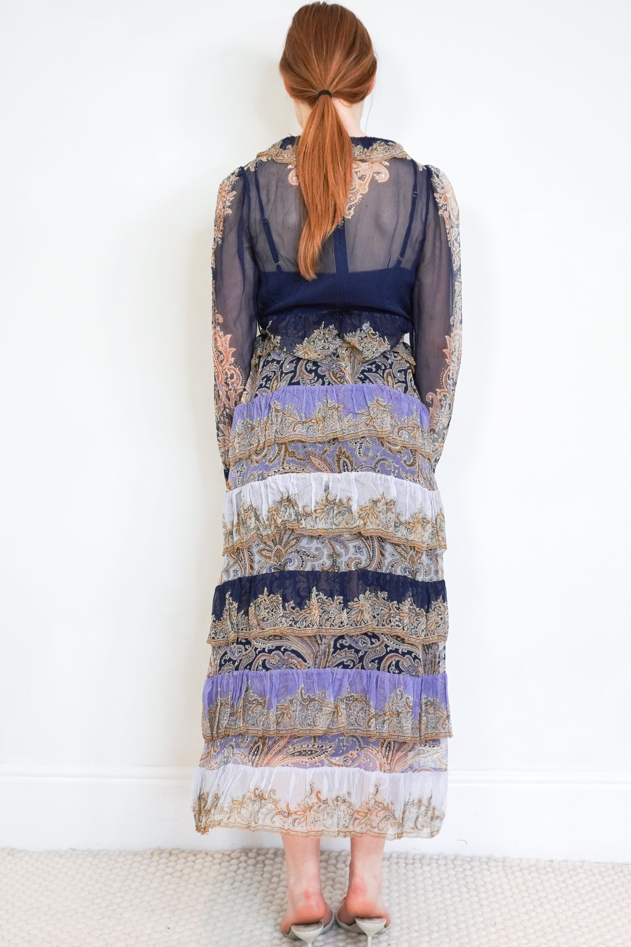 Back image of the Zimmermann paisley silk dress showing the tiered skirt.
