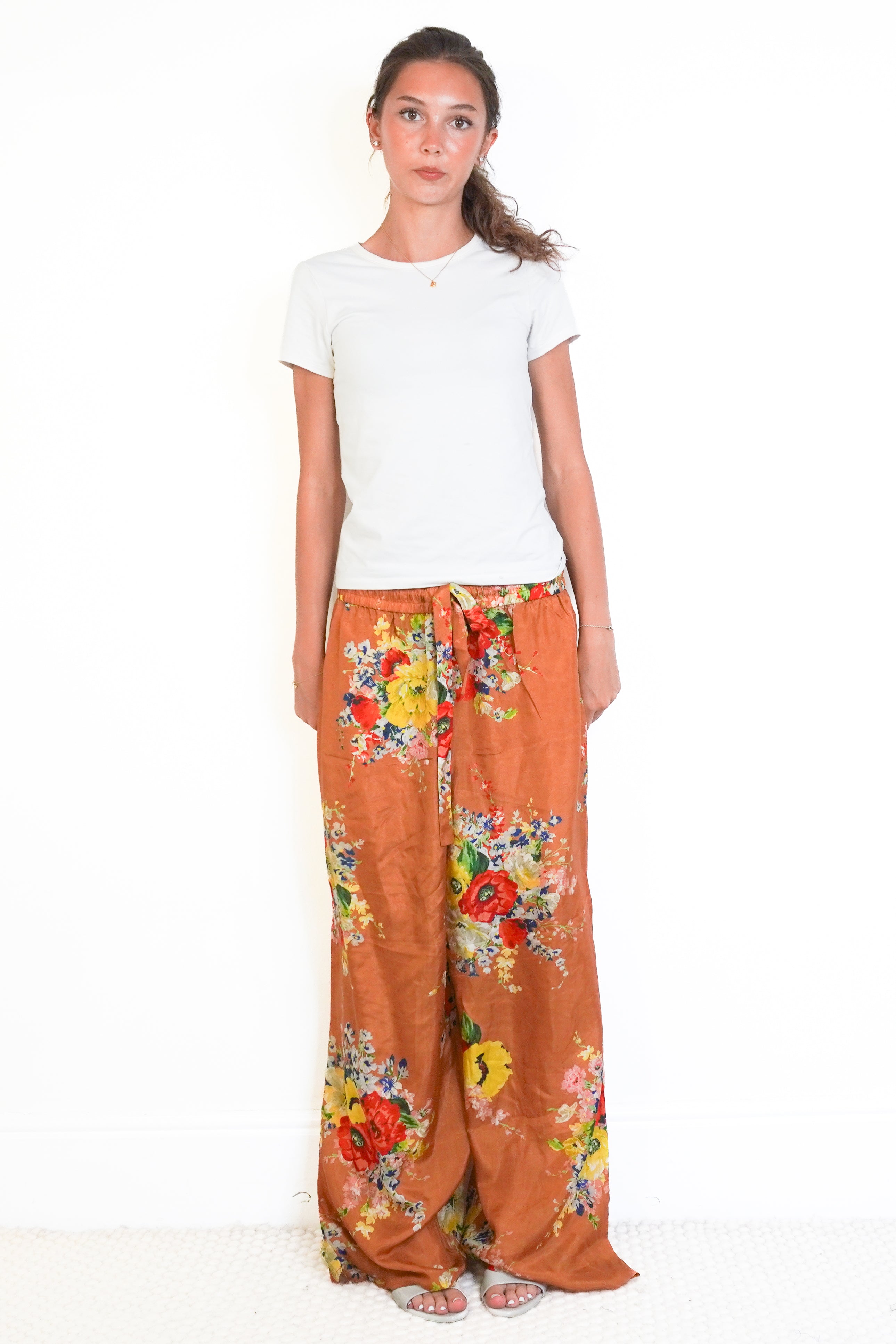 front picture of the orange floral zimmermann trousers